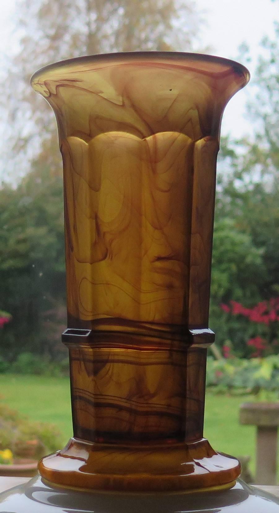 This beautiful glass vase is made by George Davidson & Co. of Gateshead, England who started production of cloud glass in 1923.

This is there column vase shape or pattern 279 and is seen in their catalogues of 1931.The vase is polished on the