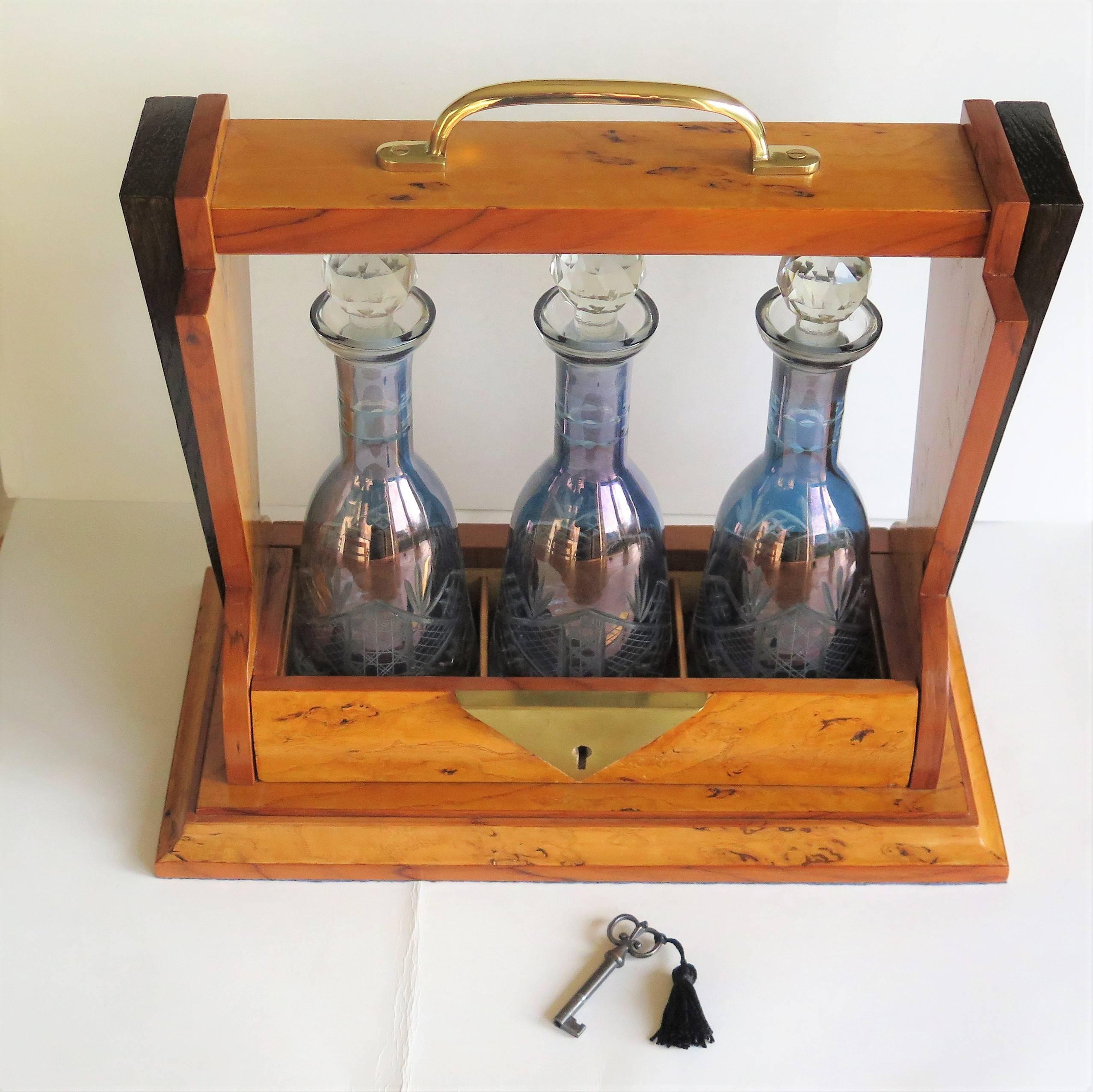 Cast Art Deco Tantalus with Three Blue Cut Glass Engraved Decanters lockable, French  For Sale