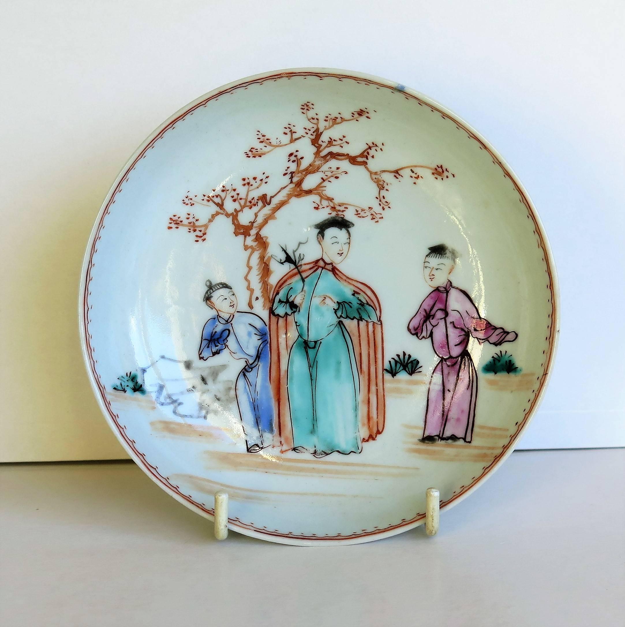 This is a fine Chinese porcelain saucer dish from the 18th century, Qing dynasty, Qianlong period, (1736-1795).

It is well potted with a neatly cut foot ring. The saucer dish is beautifully hand decorated with three figures stood in a landscape