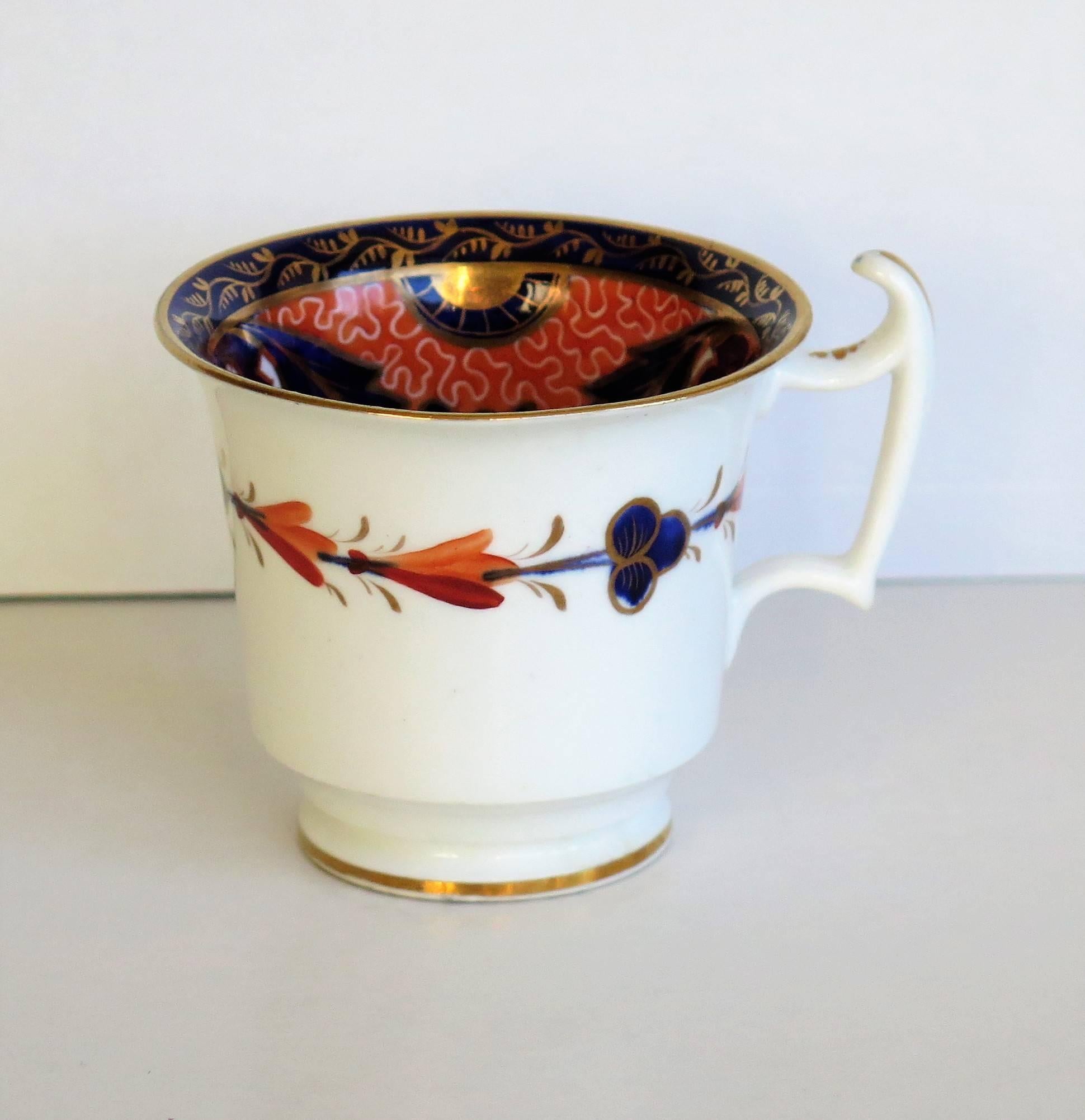 This is a stunning porcelain coffee cup from the John Rose Coalport factory, England.

The cup sits on a low foot and is of the London Shape with a spur handle.

The cup is beautifully hand painted, inside and outside, in one of their Imari 