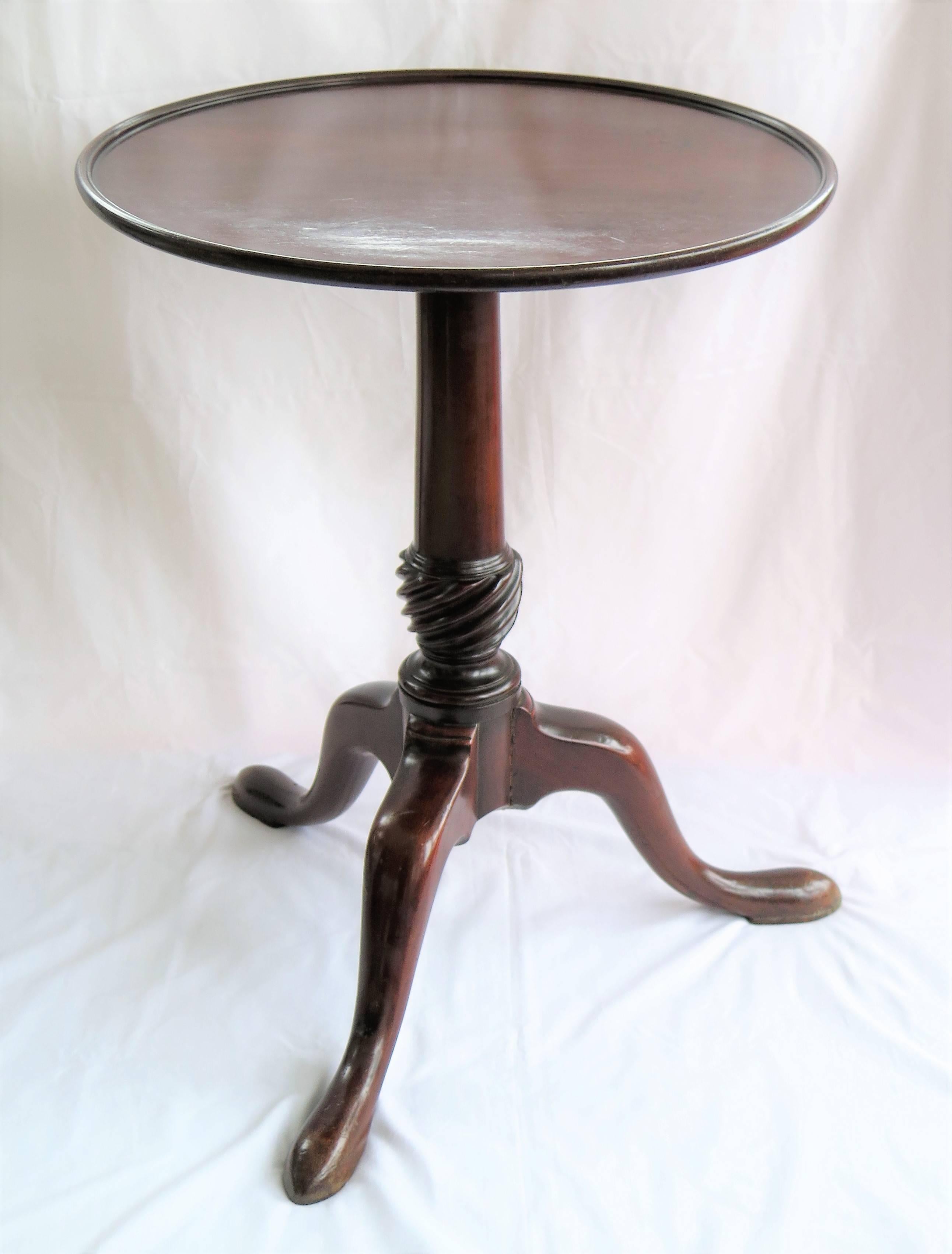 This is an elegant and beautifully proportioned, solid Mahogany, Tripod Table dating to the Mid Georgian Chippendale Period of George 11nd, circa 1750.

The dished top is made from one-piece of solid mahogany which has a finely figured grain. The