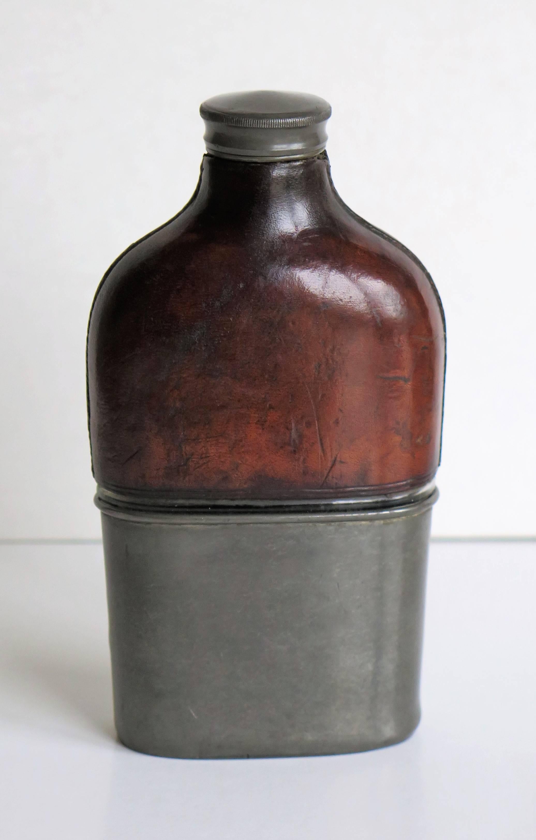 glass and leather flask