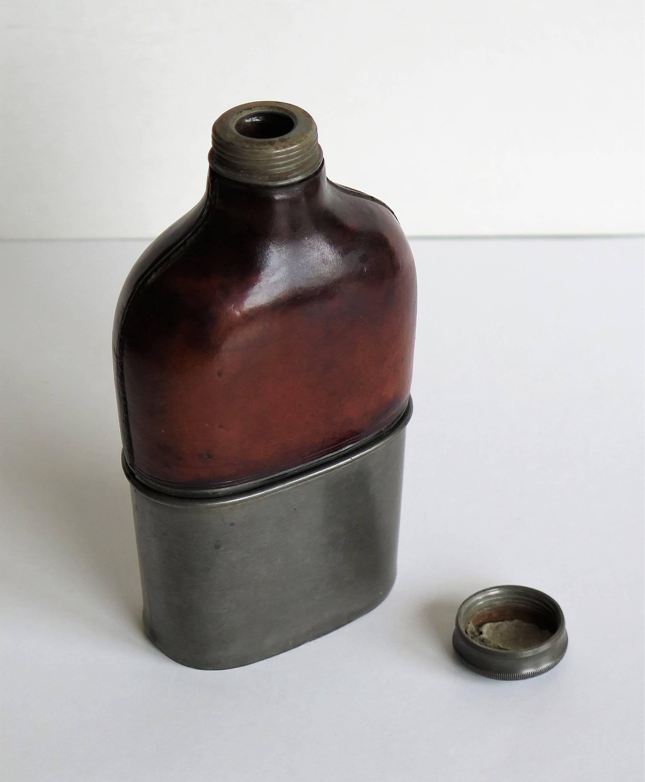leather and glass hip flask