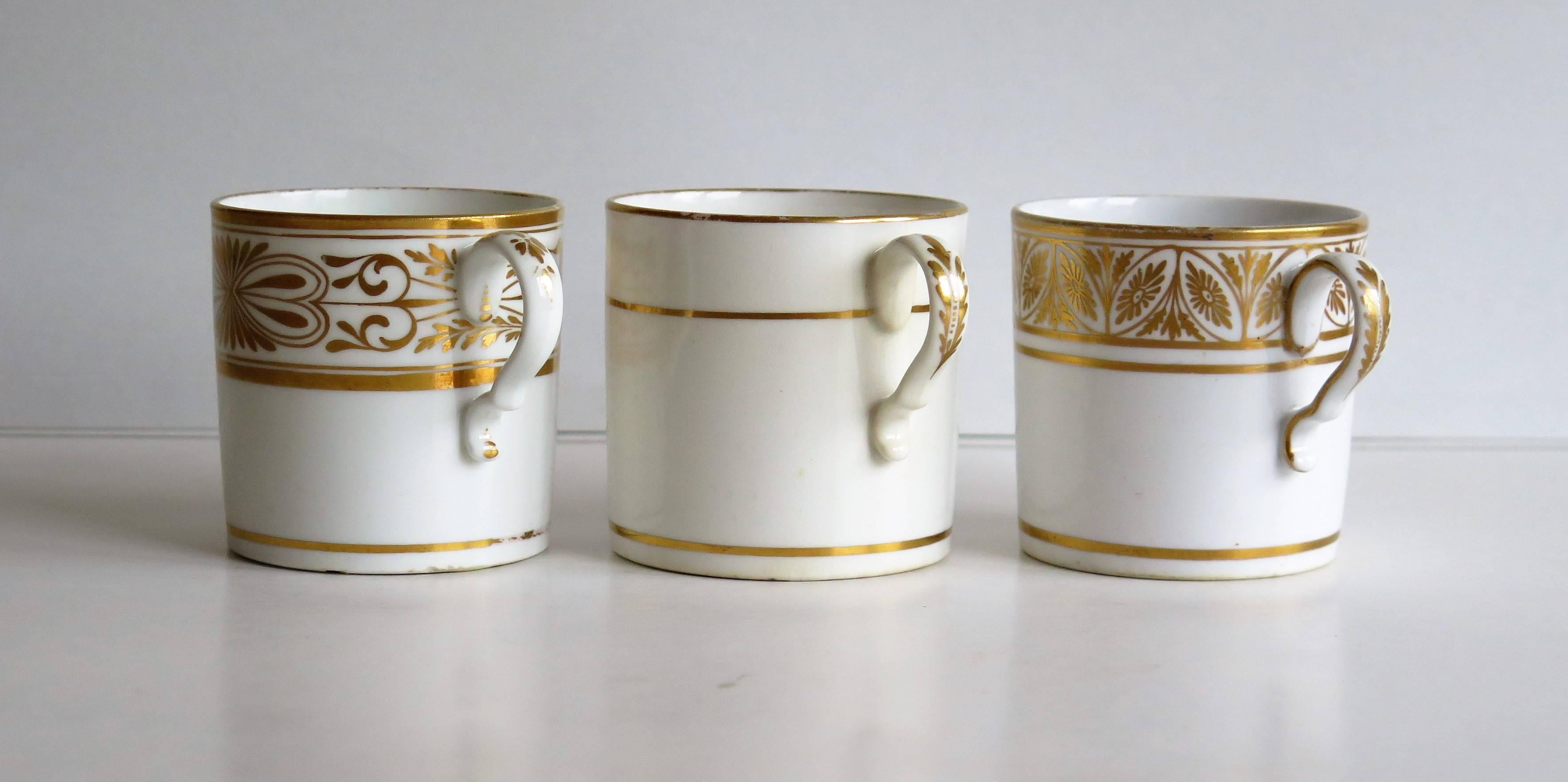 These are a set of THREE different examples of English George III period, porcelain coffee cans (cups), made by SPODE in the early part of the 19th century, circa 1810.

The cans are nominally straight sided of very similar dimensions and have the