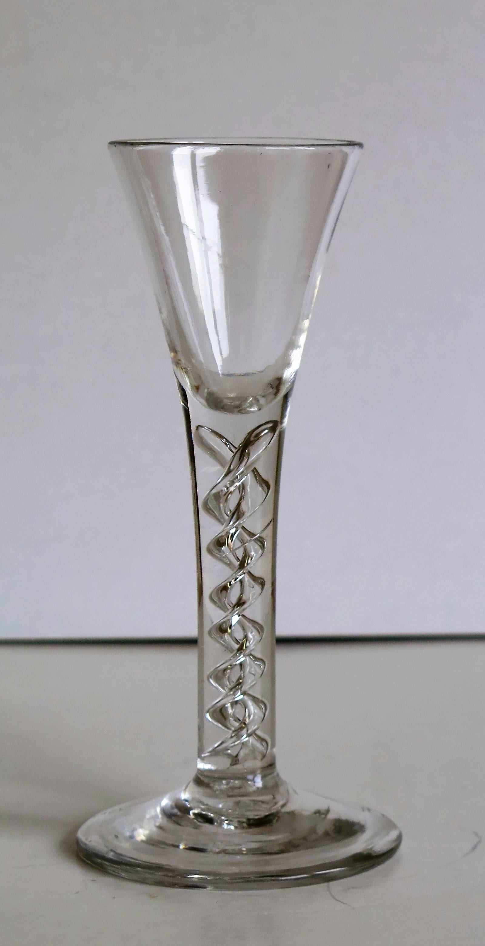This is a superb English, Georgian, handblown, wine drinking glass, with a 'Mercury' Air Twist stem, dating to the middle of the 18th century, circa 1750. 

These glasses are very collectable.

It is handmade from English lead glass which is