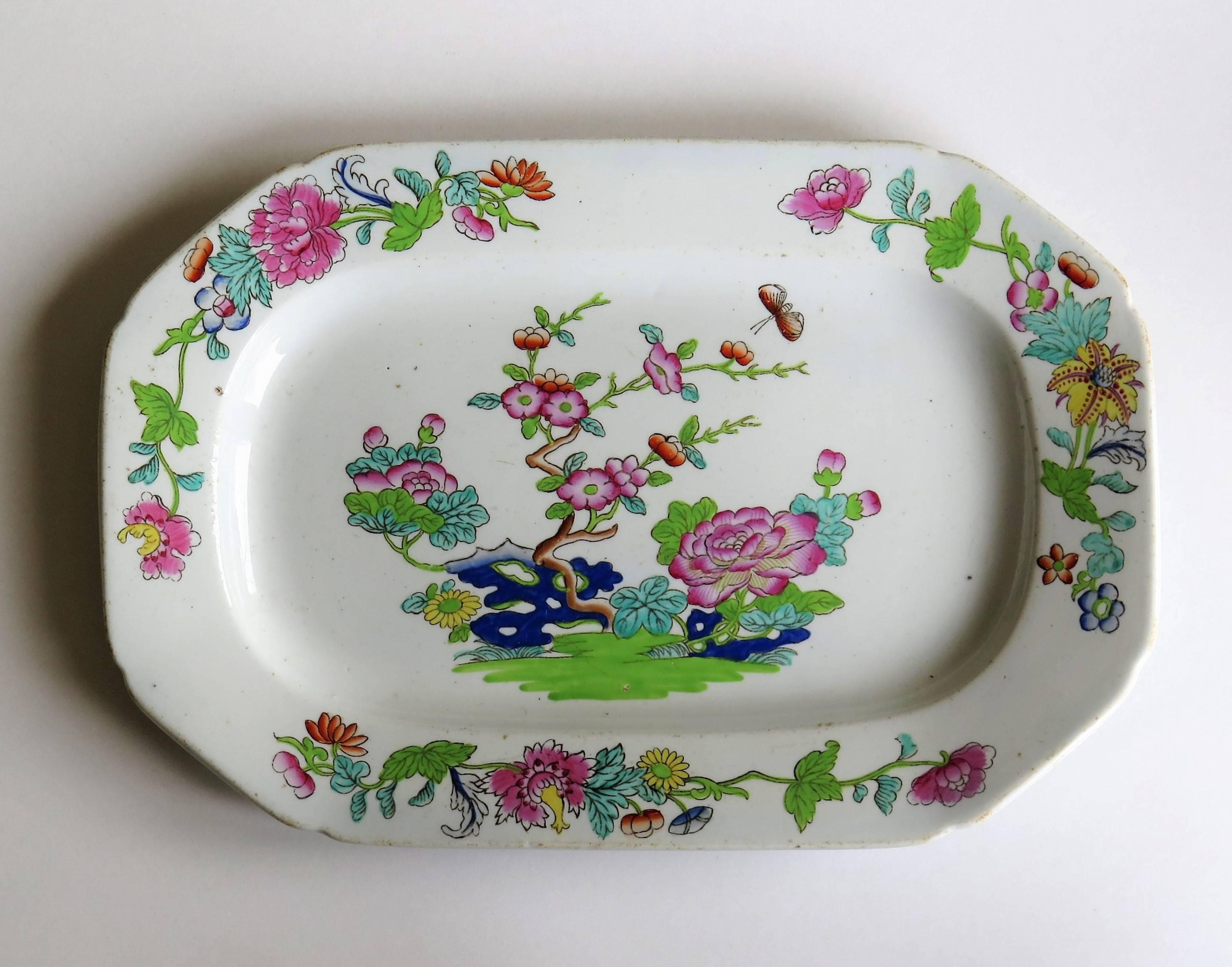 This is a beautiful platter, produced by the Spode factory.

This is pattern number 2148, named the 'Willis' pattern. The chinoiserie decoration was transfer printed in grey under-glaze, then carefully and beautifully hand-painted in bold colored