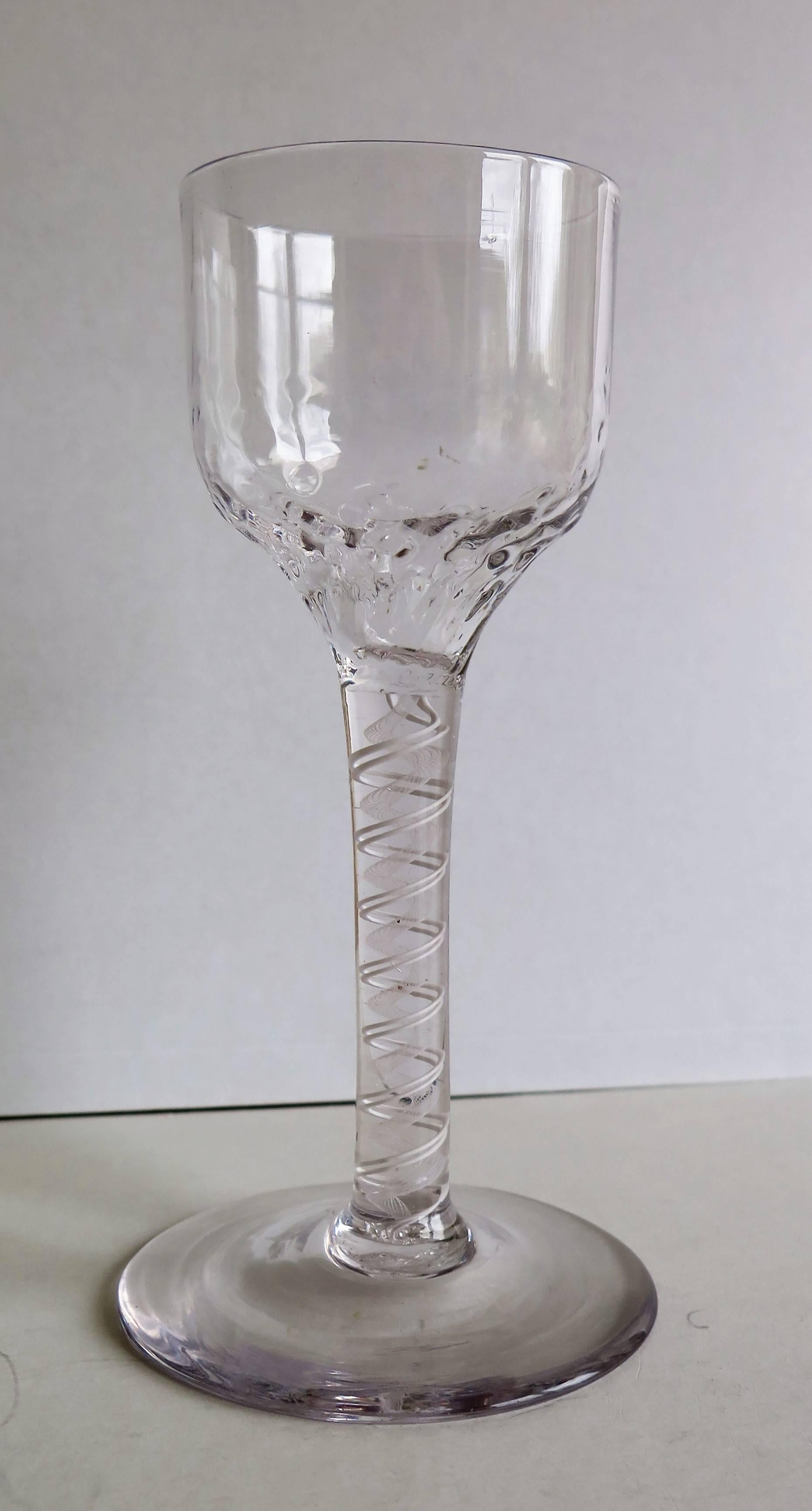 This is a good hand-blown, English, mid-Georgian, Cordial drinking glass with a double series, cotton or opaque twist (DSOT) stem, dating from the middle of the 18th century, circa 1765.

These glasses are very collectable. It is made from English