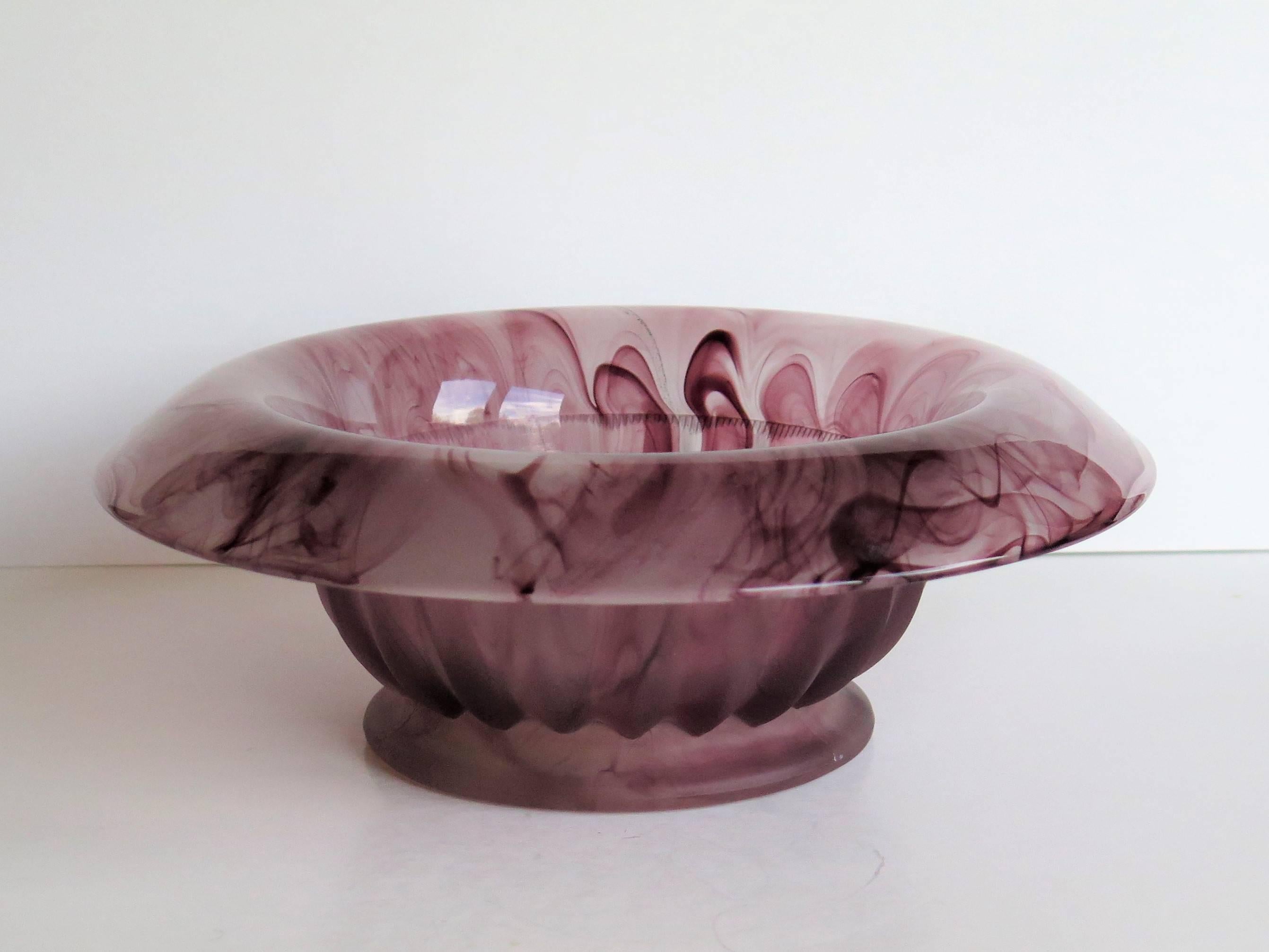 This is a beautiful glass bowl made by George Davidson and Co. of Gateshead, England who started production of cloud glass in 1923.

This bowl has a roll-over rim and is shape or pattern 1910BD as seen in their catalogues of 1931.The bowl has a