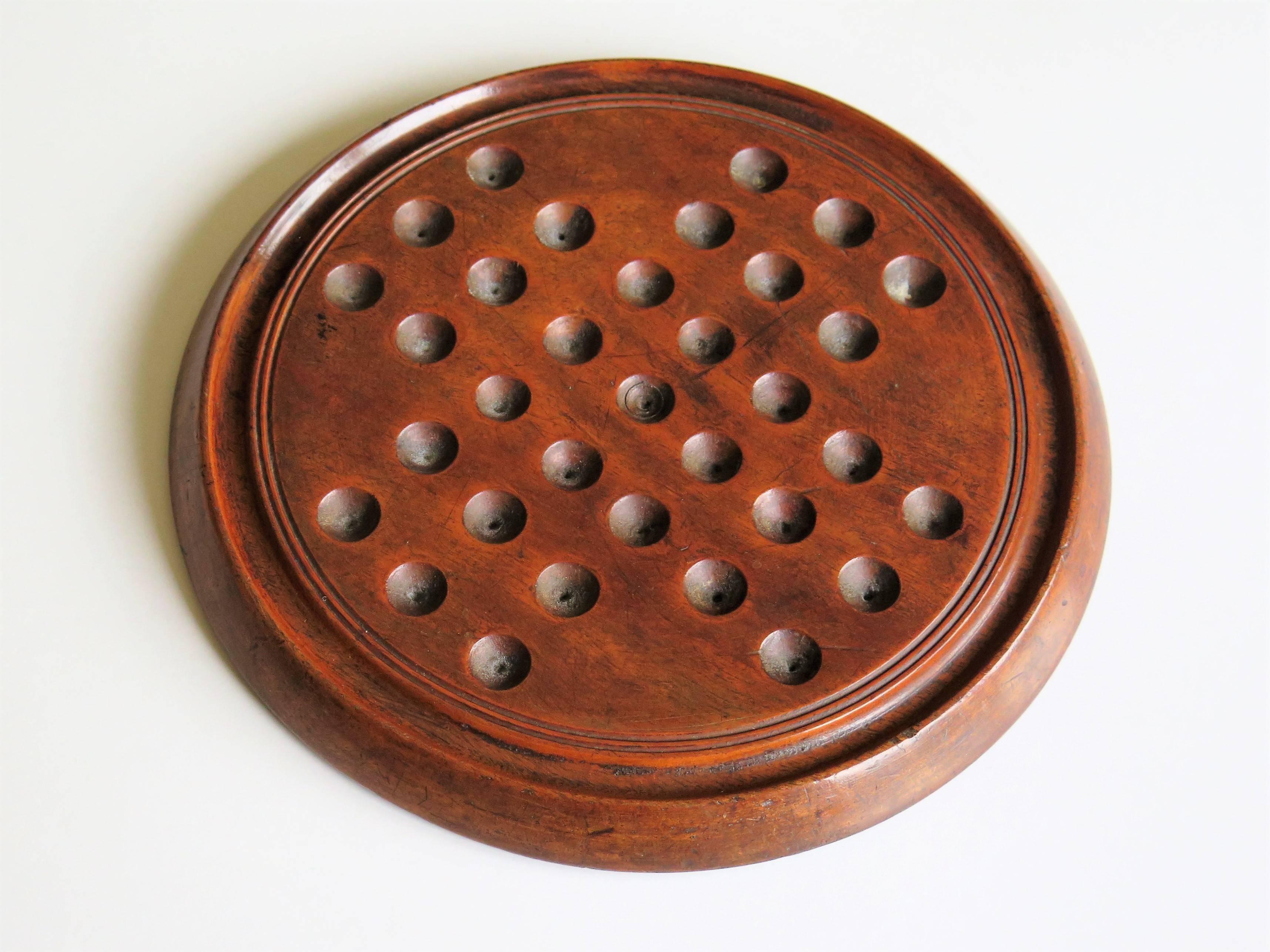 Mahogany Mid-19th Century Solitaire Marble Board Game with 32 Early Handmade Marbles