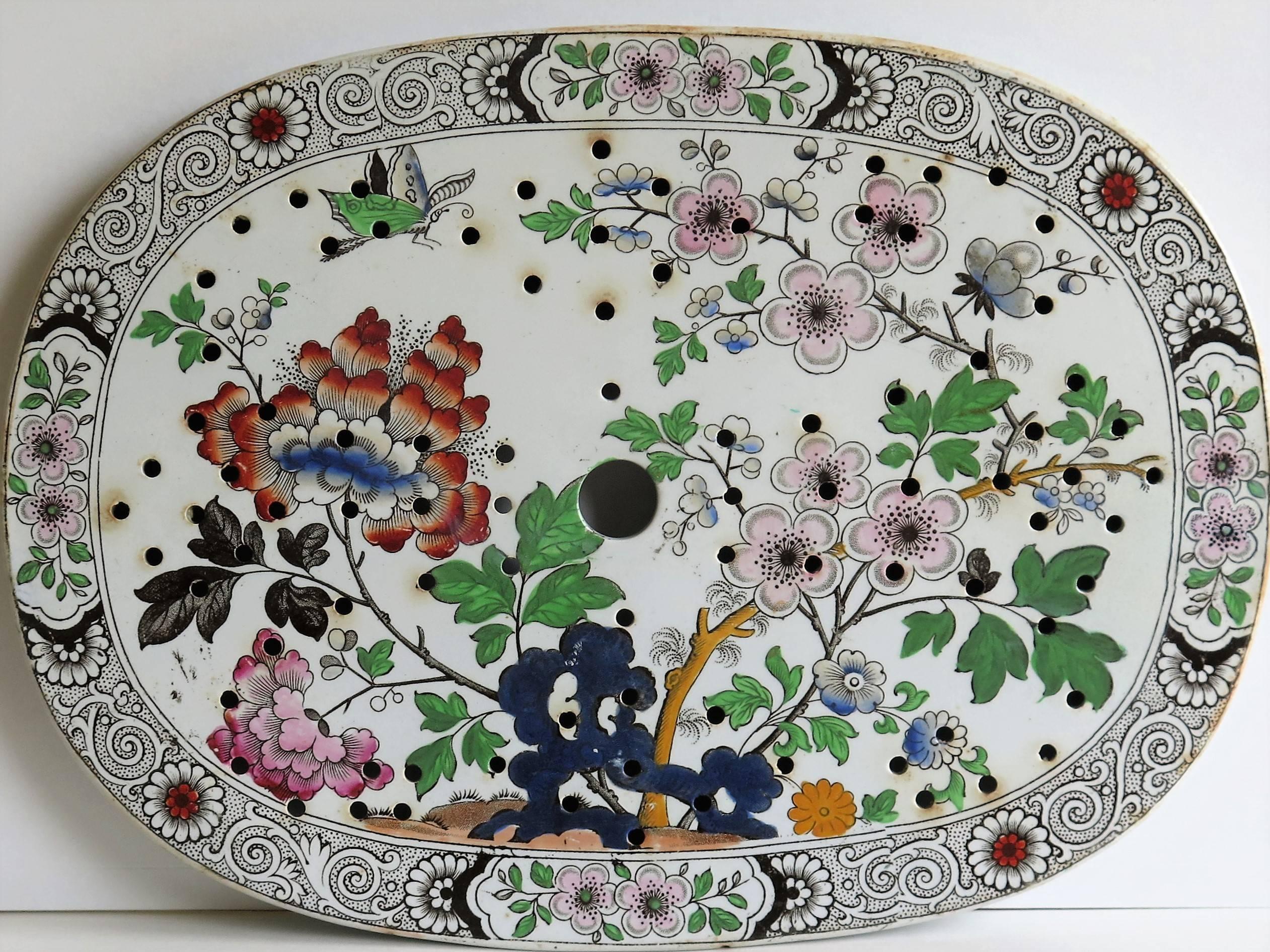 This is a good rounded oval ironstone (stone china) drainer plate, Circa 1830, which we attribute to the factory of Hicks, Meigh and Johnson of Shelton, Staffordshire Potteries, England, who made good quality earthenware and ironstone wares between