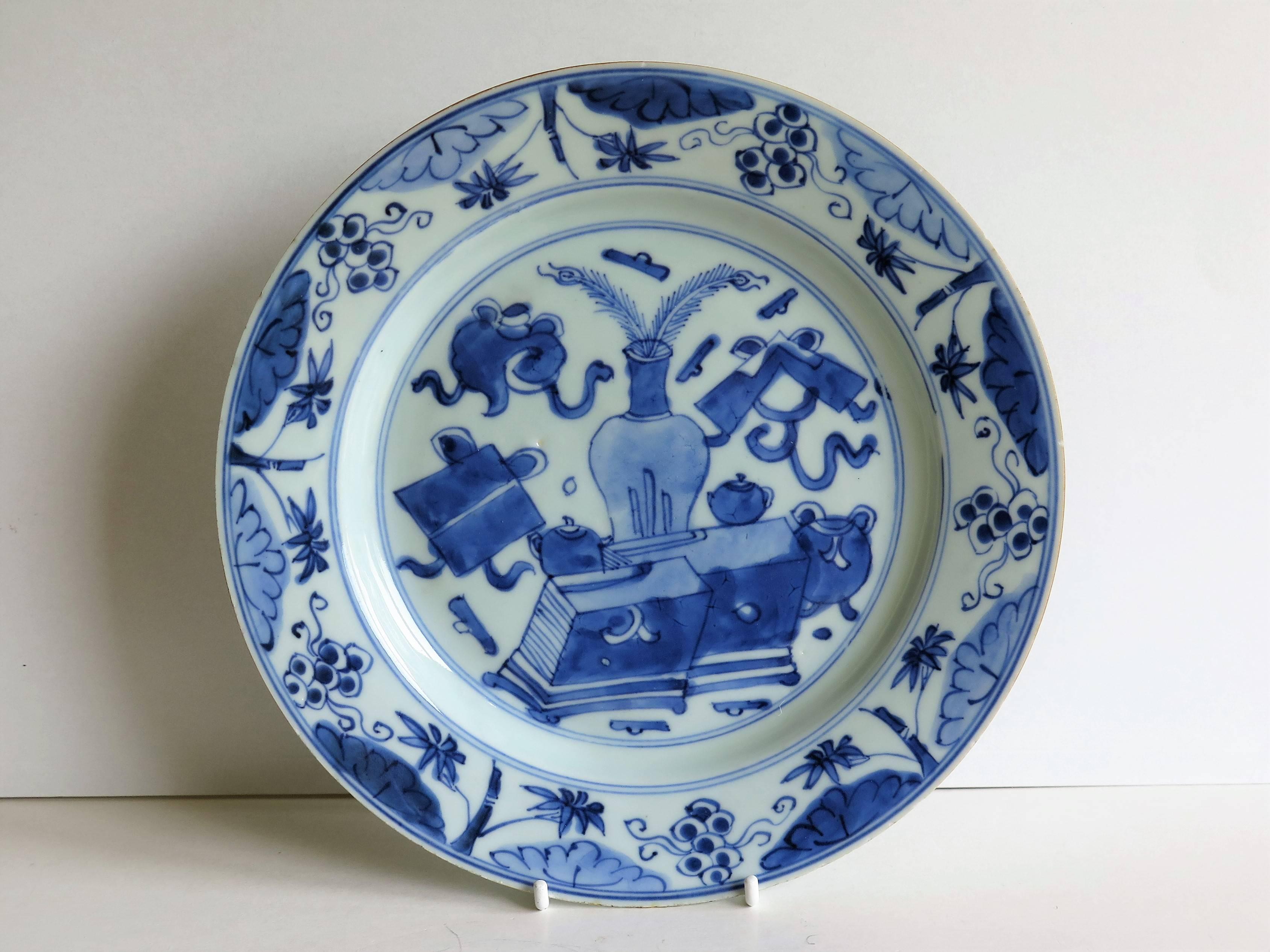 This is a beautiful hand-painted Chinese porcelain plate, dating to the early / mid-18th century, circa 1720-1750, Qing dynasty.

The plate is well potted, and has been hand decorated in varying shades of cobalt 'steel' blue. The glaze is thin and