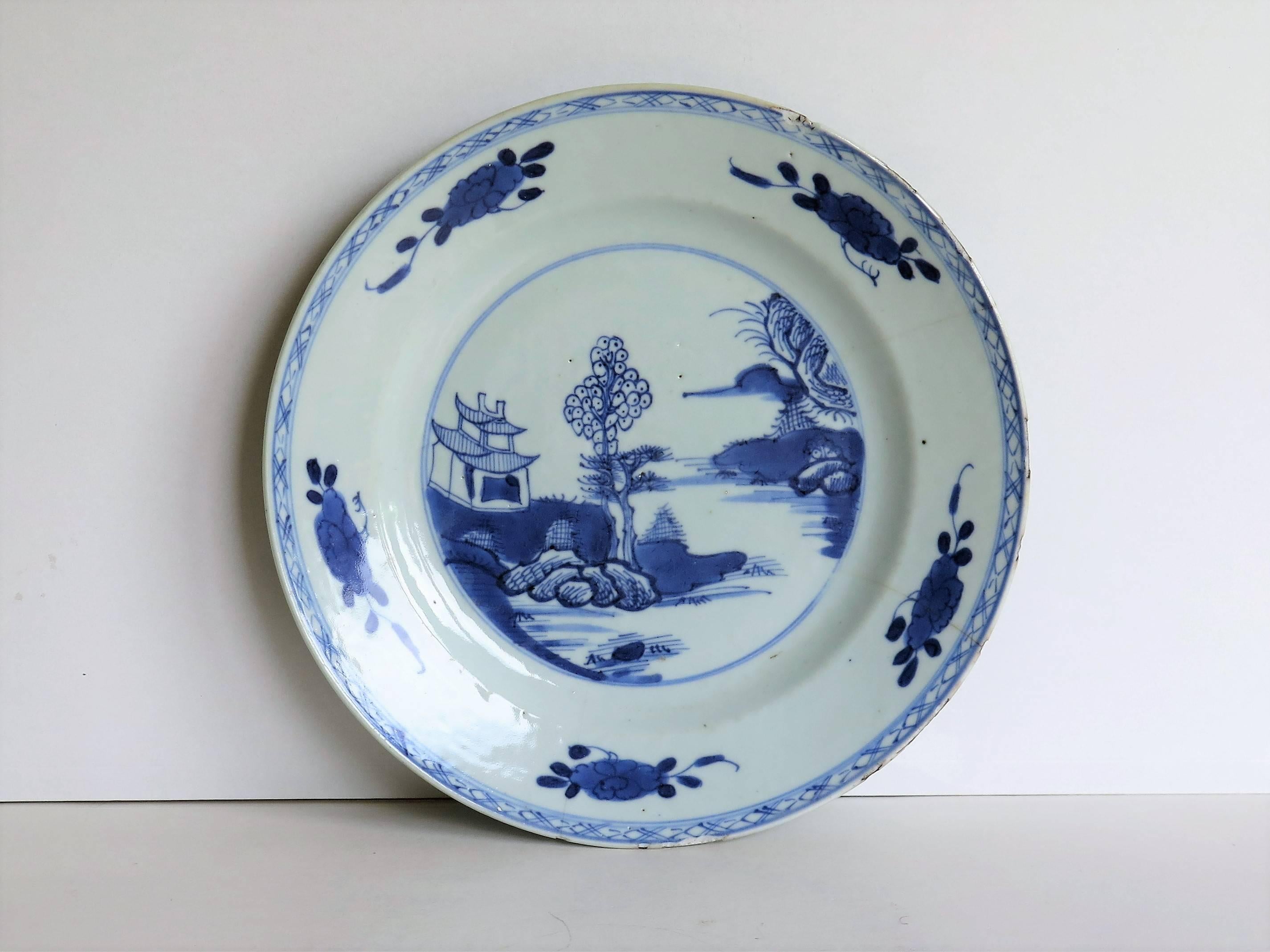 This is a hand-painted Chinese porcelain plate and makes a good display or wall plate.

The plate is well potted with a lovely glassy light blue glaze

The plate has a very attractive well set out design that is carefully hand-painted in varying