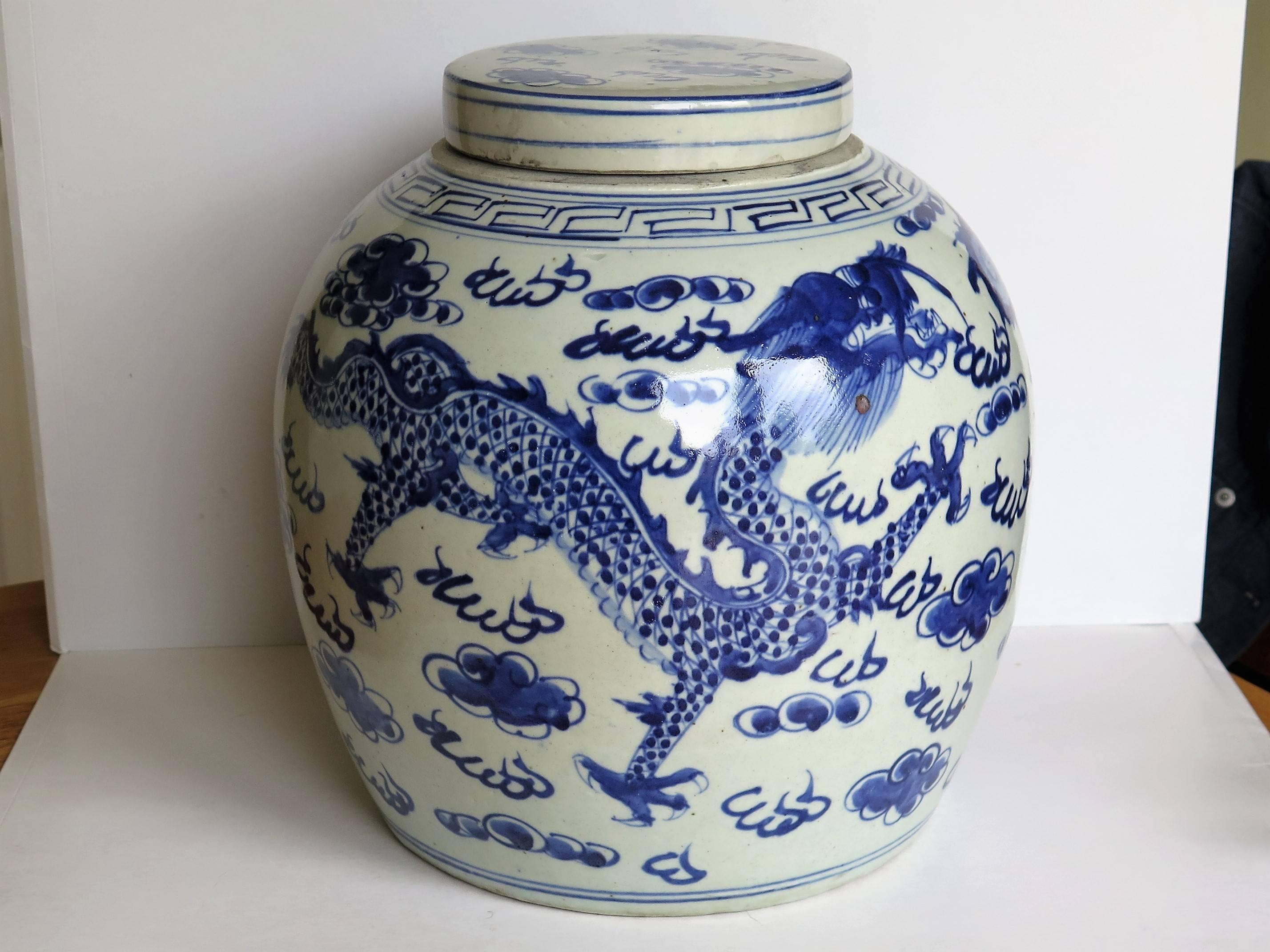 This is a very large Chinese porcelain lidded or covered jar.

The jar is hand potted and comes complete with its original lid.

The jar is beautifully hand decorated in a free flowing style with various shades of cobalt blue, showing two four-toed