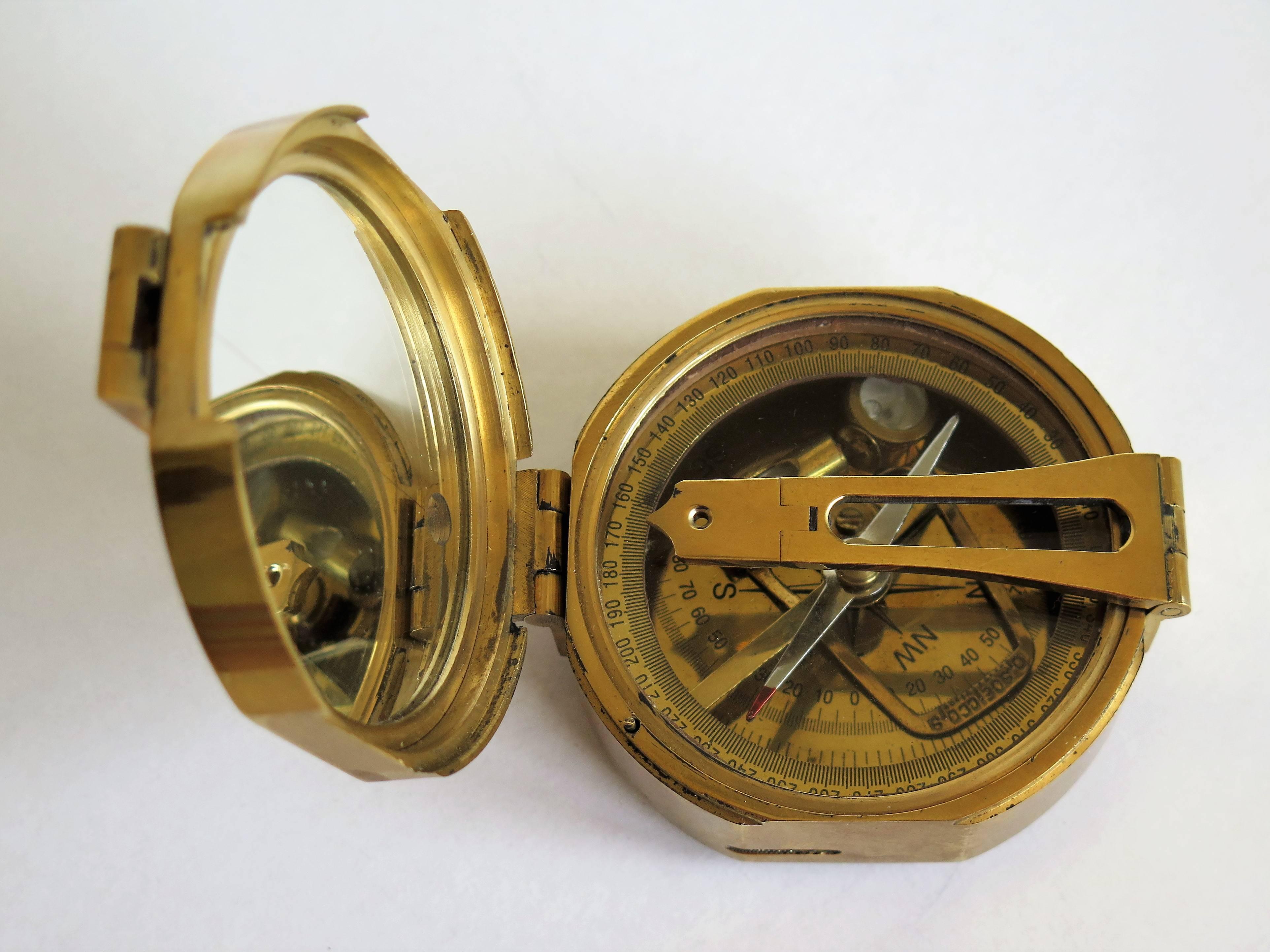 This is a vintage, solid brass, Stanley, Natural Sine compass in a teak wood box. It is engraved to the top; Natural Sine Stanley London.

It has a hinged mirrored lid and hinged folding sight. It is fully adjustable with two internal bubble level