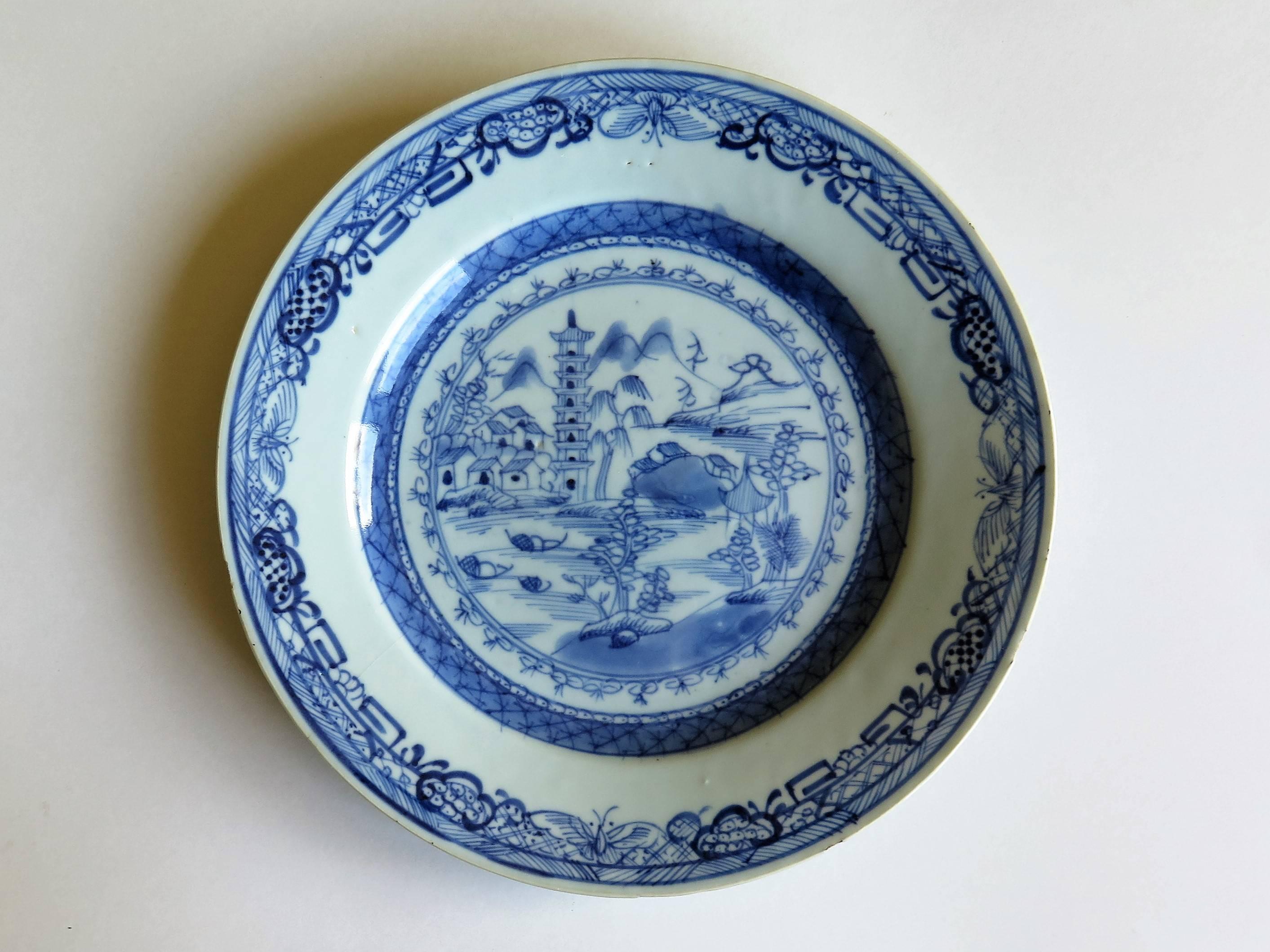This is a good Chinese Porcelain, blue and white plate made for the export (Canton) market.

The plate is circular in shape, decorated in varying shades of cobalt blue, with a glaze of a very light blue shade. The foot rim has been neatly trimmed