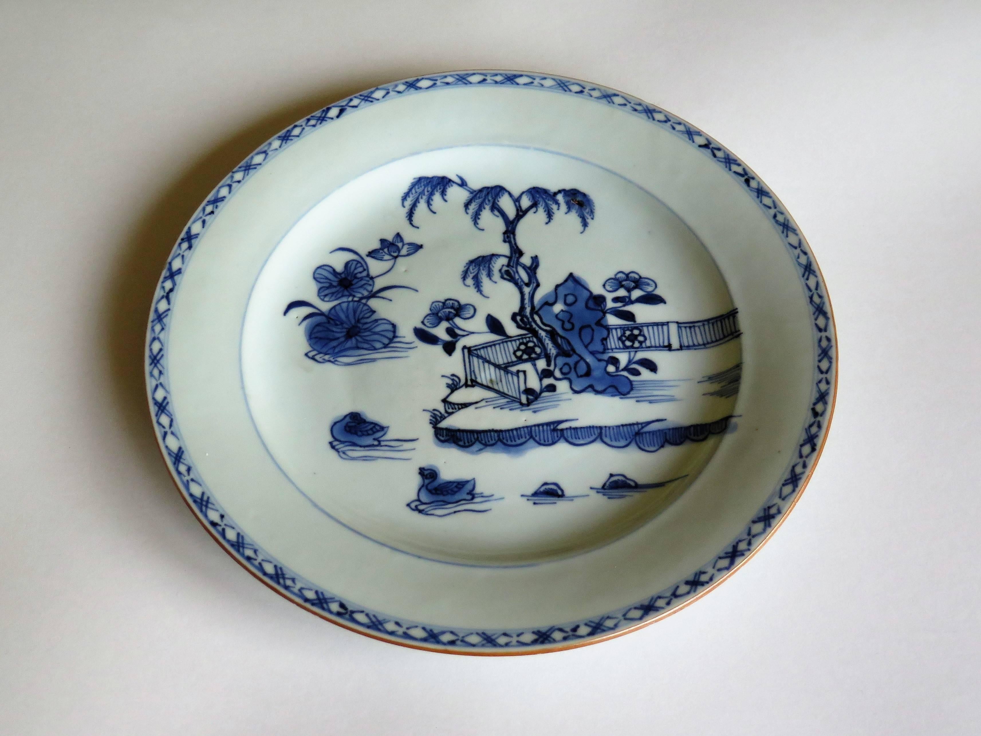 This is a nicely hand-painted Chinese blue and white porcelain plate, which we date to the second half of the 18th century, Qing Qianlong period, circa 1760.

The plate is well potted with a lovely glassy light blue glaze and a very neatly cut