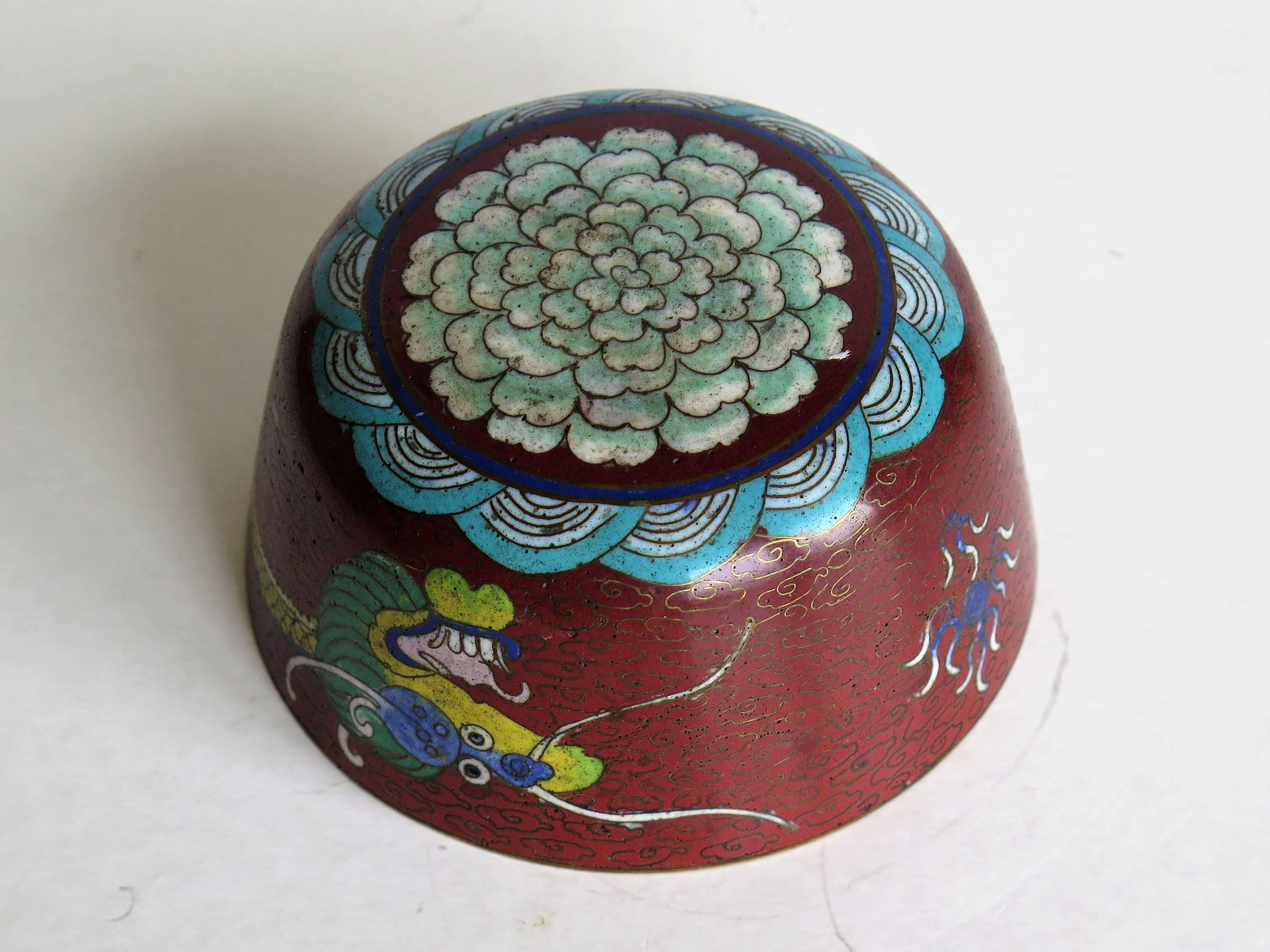 This is a good Chinese Cloisonné drinking bowl that we date to the mid-19th century of the Qing dynasty.

The bowl has slightly curved sides and a rounded and decorated base, the bowl probably being used for drinking from, such that the base