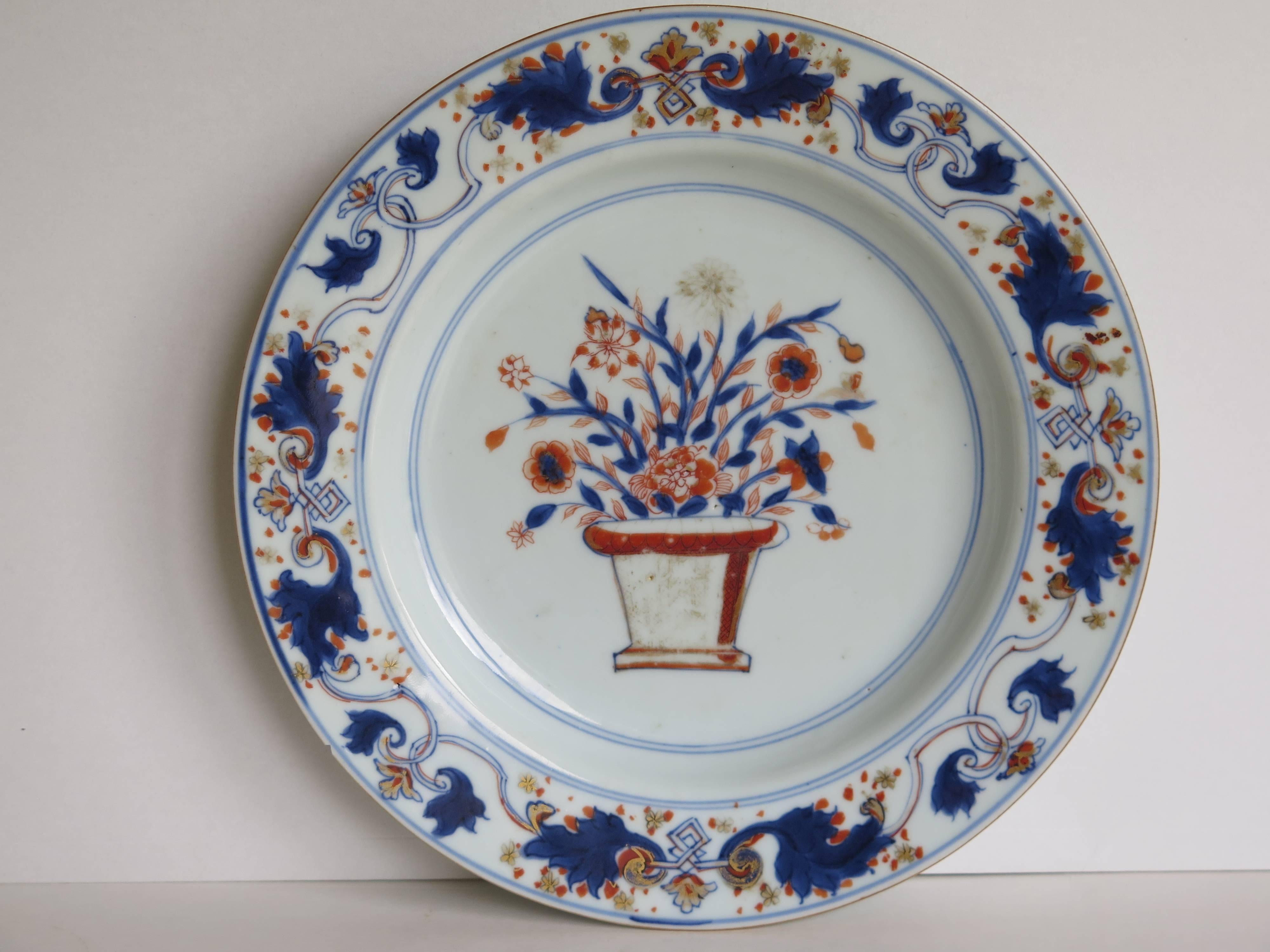 This is a very good Chinese porcelain plate from the early 18th century, Qing dynasty, probably Kangxi period, circa 1720 or slightly earlier.

The plate is well potted with a glassy white glaze having a soft blue tinge and a neatly cut foot