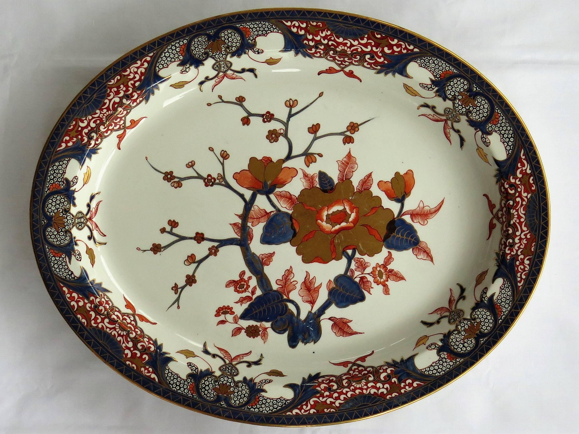 This is a rare and early Derby Porcelain large dish, platter or meat plate from the late 18th century, George III period, circa 1790.

The platter is oval in shape and is beautifully hand-painted in one of Derby's chinoiserie, Imari patterns called;