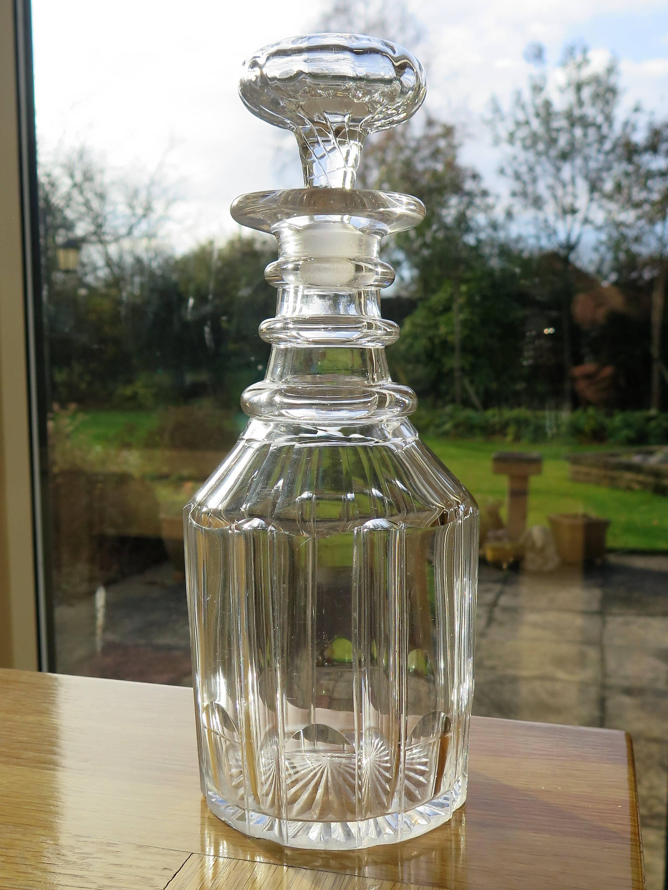 This is a good Anglo-Irish cut-glass or crystal decanter made early in the 19th century, circa 1815, during the English Regency, late Georgian period.

The decanter is nominally straight sided and is beautifully cut in eight broad vertical columns