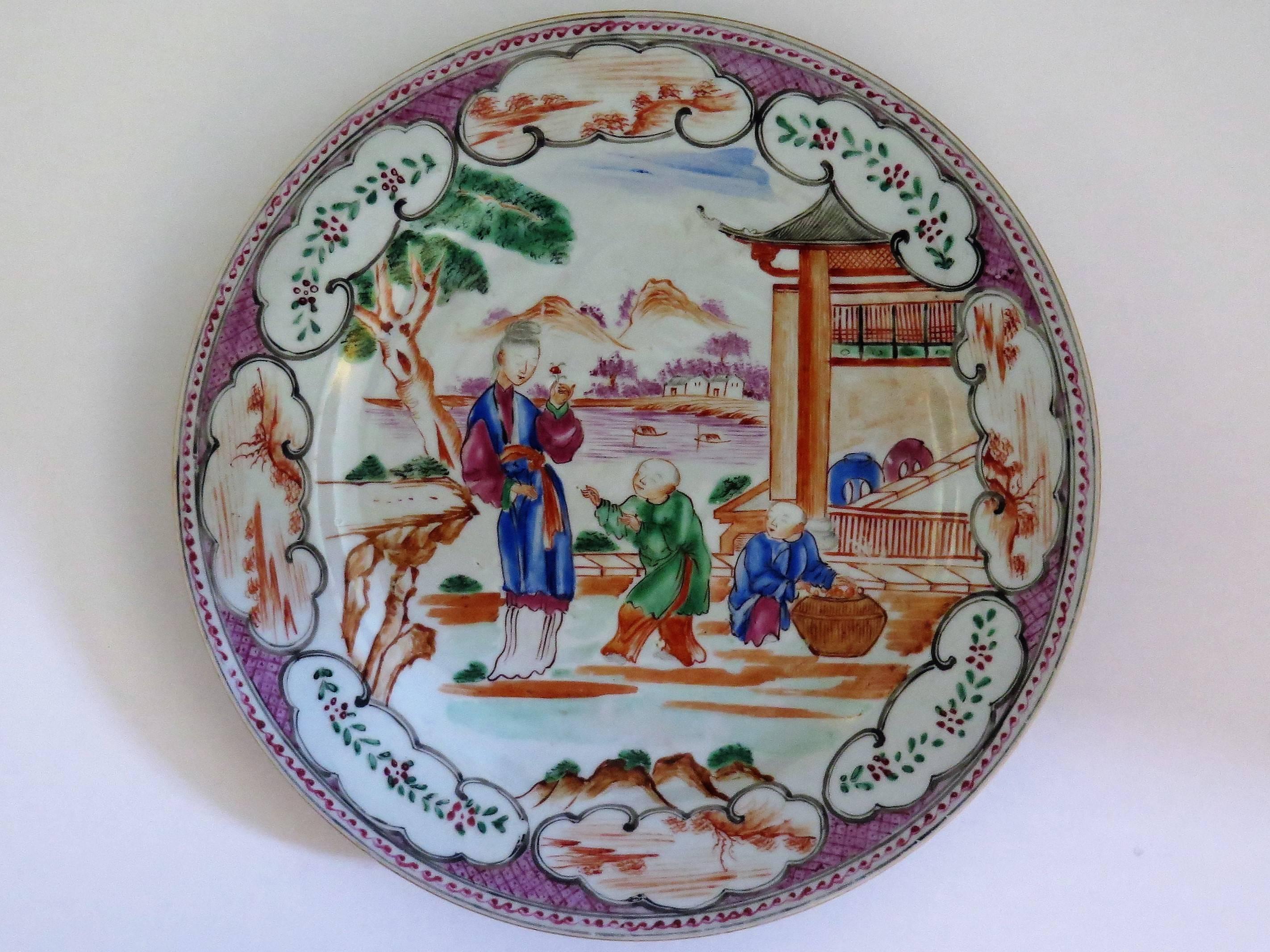This is a fine Chinese plate from the 18th century, Qing dynasty, Qianlong period, 1736-1795 in very good condition.

It is beautifully decorated with three figures in a pagoda setting, having a lady (long eliza) and two children stood on a