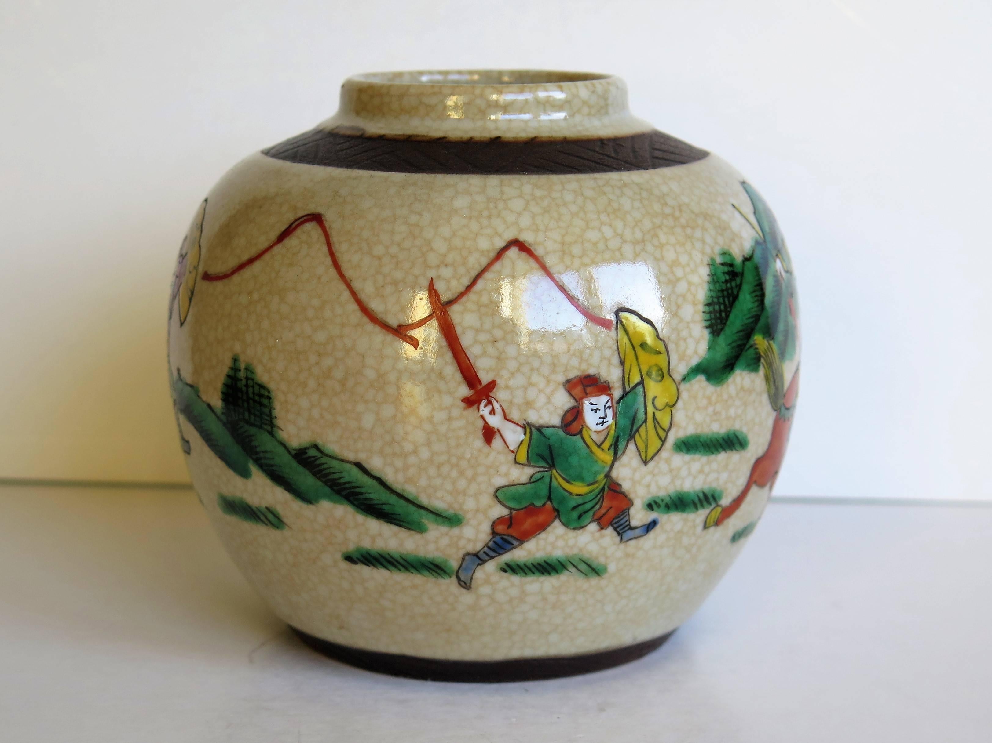 This is a good small ceramic jar produced in China, in the late Qing period of the early 20th century, for the Export market.

The jar has a creamy crackle glaze ground which is nicely hand decorated in polychrome enamels using burnt orange, green,