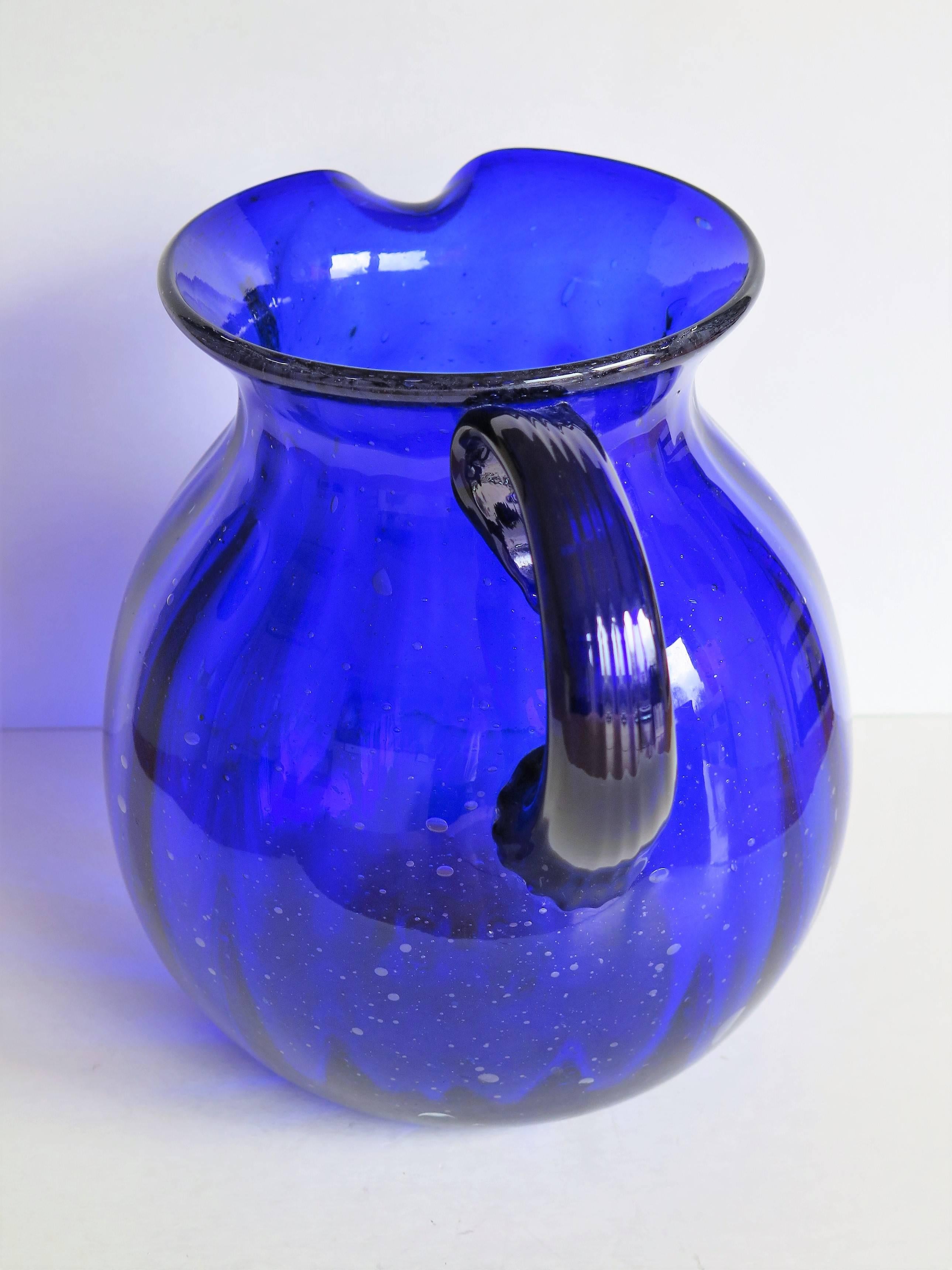 large blue glass jug