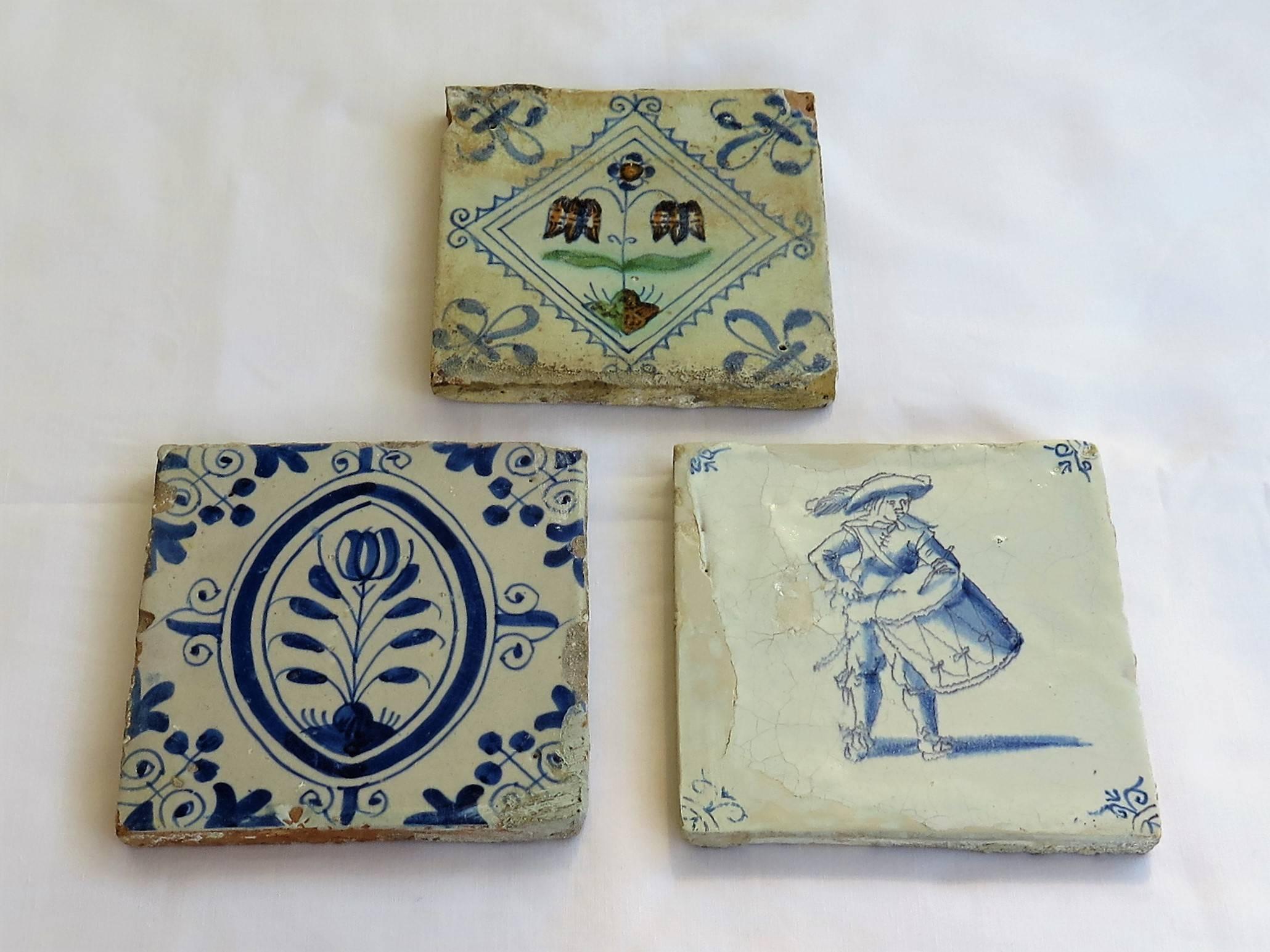 These are THREE very attractive and interesting, Dutch (Netherlands), Delft Ceramic Wall Tiles dating to the 17th Century.

All tiles are nominally 5 inches square and 7/16 inches thick. 

Tile 1 - Top  - Polychrome
This is probably the oldest tile,