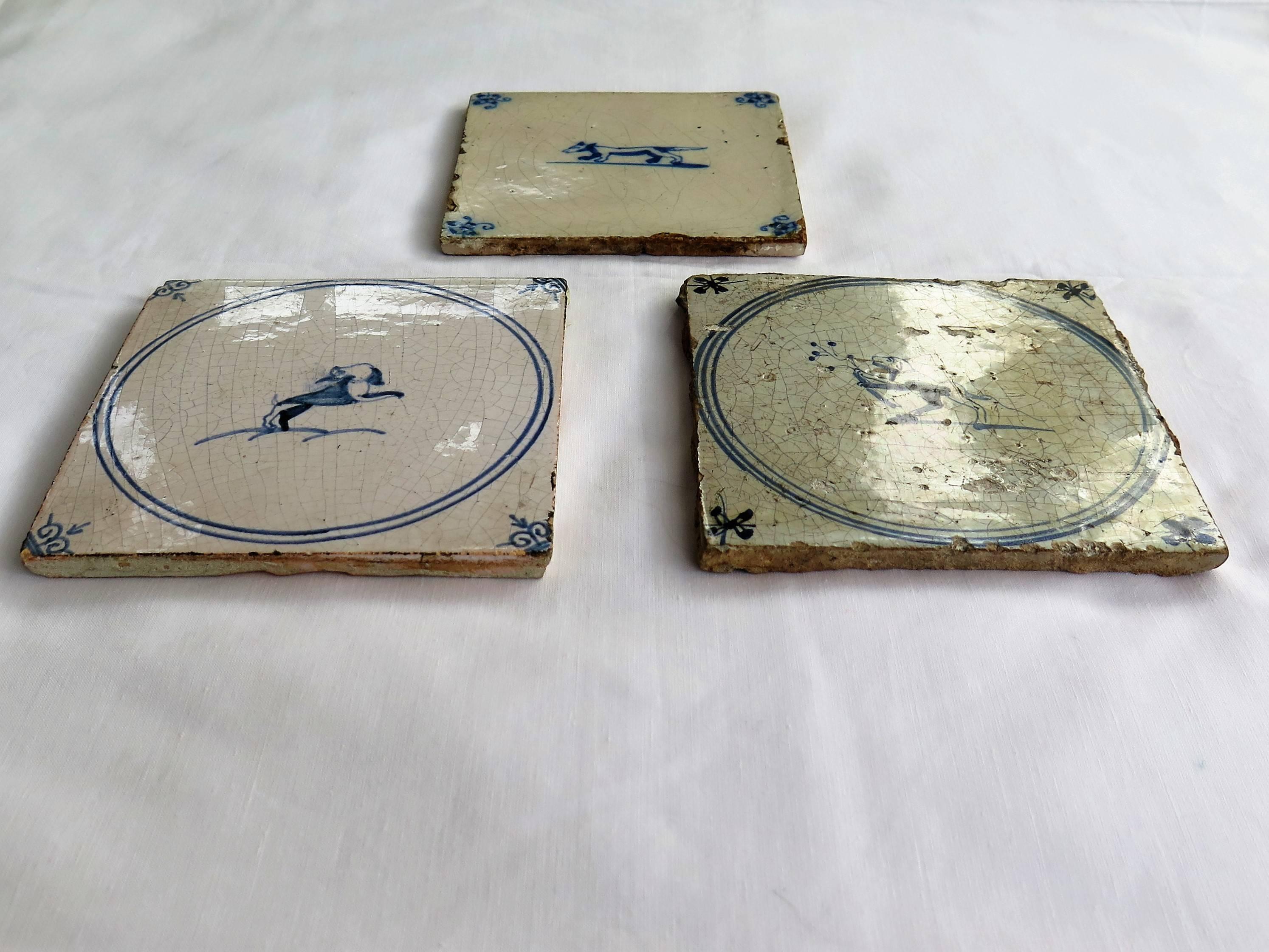 Dutch Colonial Three 18th Century Delft Blue and White Ceramic Wall Tiles, Dog Patterns