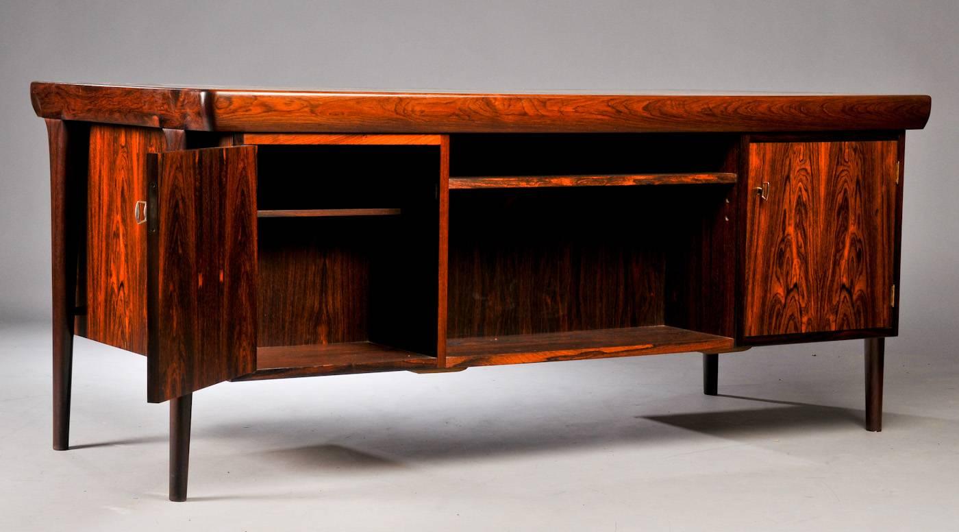 This rosewood desk is an interesting piece on many levels. 

Firstly, the desk is made of dark rosewood displaying a very high contrast of colors in the figure of the wood. For those who seek out the fanciest wood for your collection, it does not