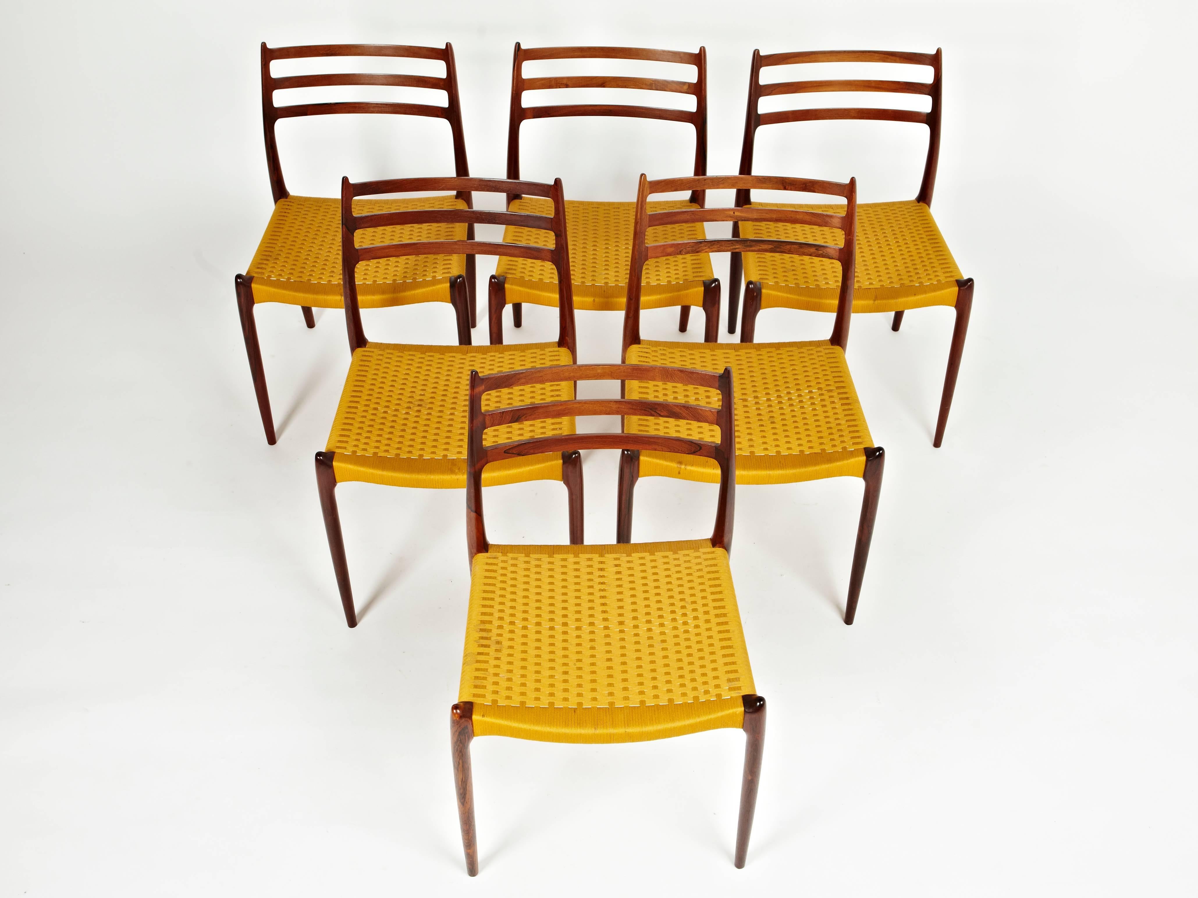 Niels Otto Møller, Group of 16 Rosewood Dining Chairs in Original Yellow Cord In Excellent Condition For Sale In London, GB