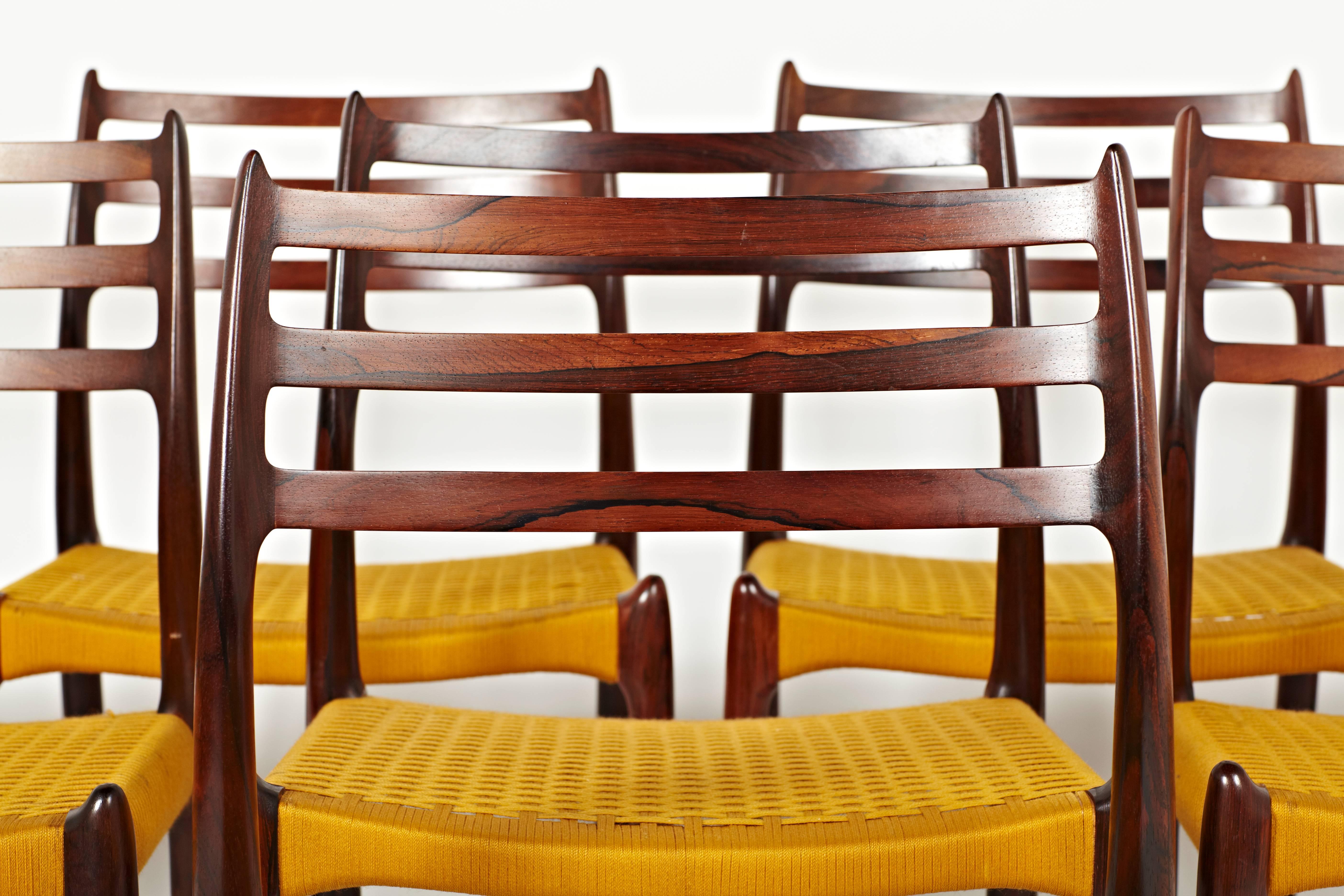 Mid-20th Century Niels Otto Møller, Group of 16 Rosewood Dining Chairs in Original Yellow Cord For Sale