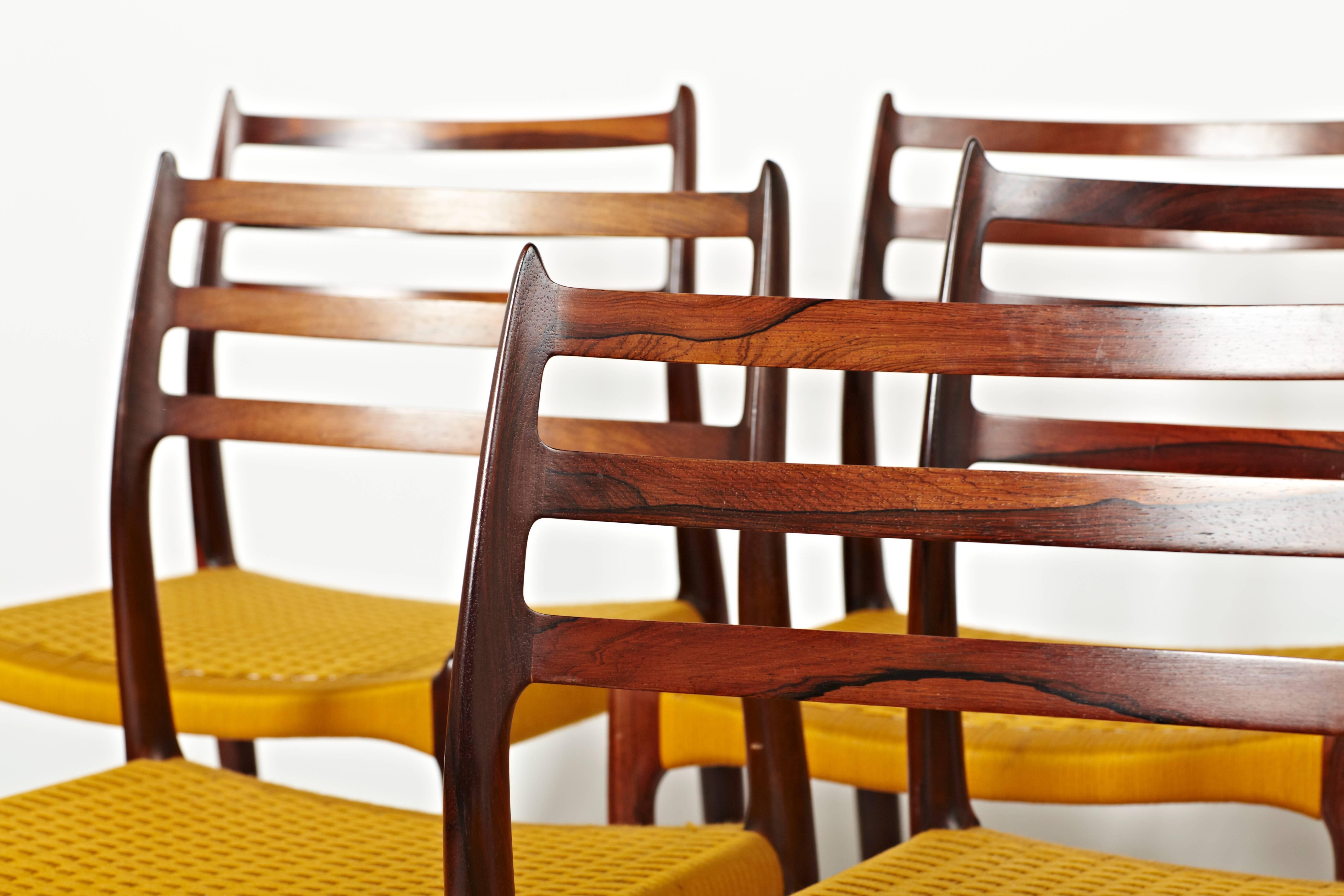 Niels Otto Møller, Group of 16 Rosewood Dining Chairs in Original Yellow Cord For Sale 1