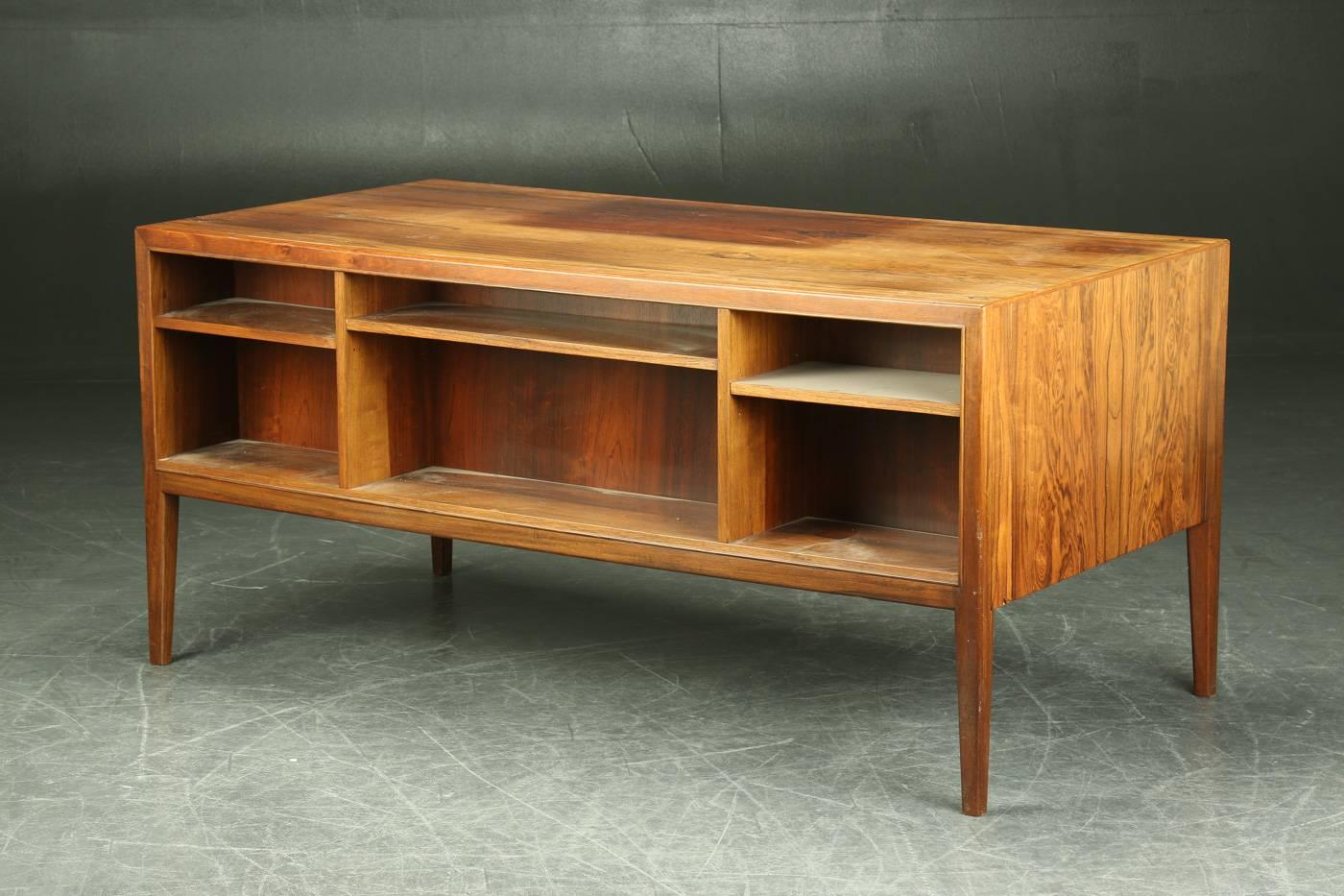This rosewood desk was made in Denmark during the 1940s in Denmark. With a good height of 75cm or 29-1.2 inches, the desk is pictured in original condition. Upon purchase and included in the price listed, the table will be re-polished to restore