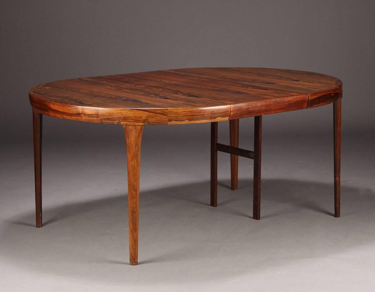 An exceptional example of Faarup's popular round dining table with two extension leaves. Both leaves have aprons, unlike some other examples. The exceptional rosewood figure speaks for itself.

Restoration involves re-lacquering to replace