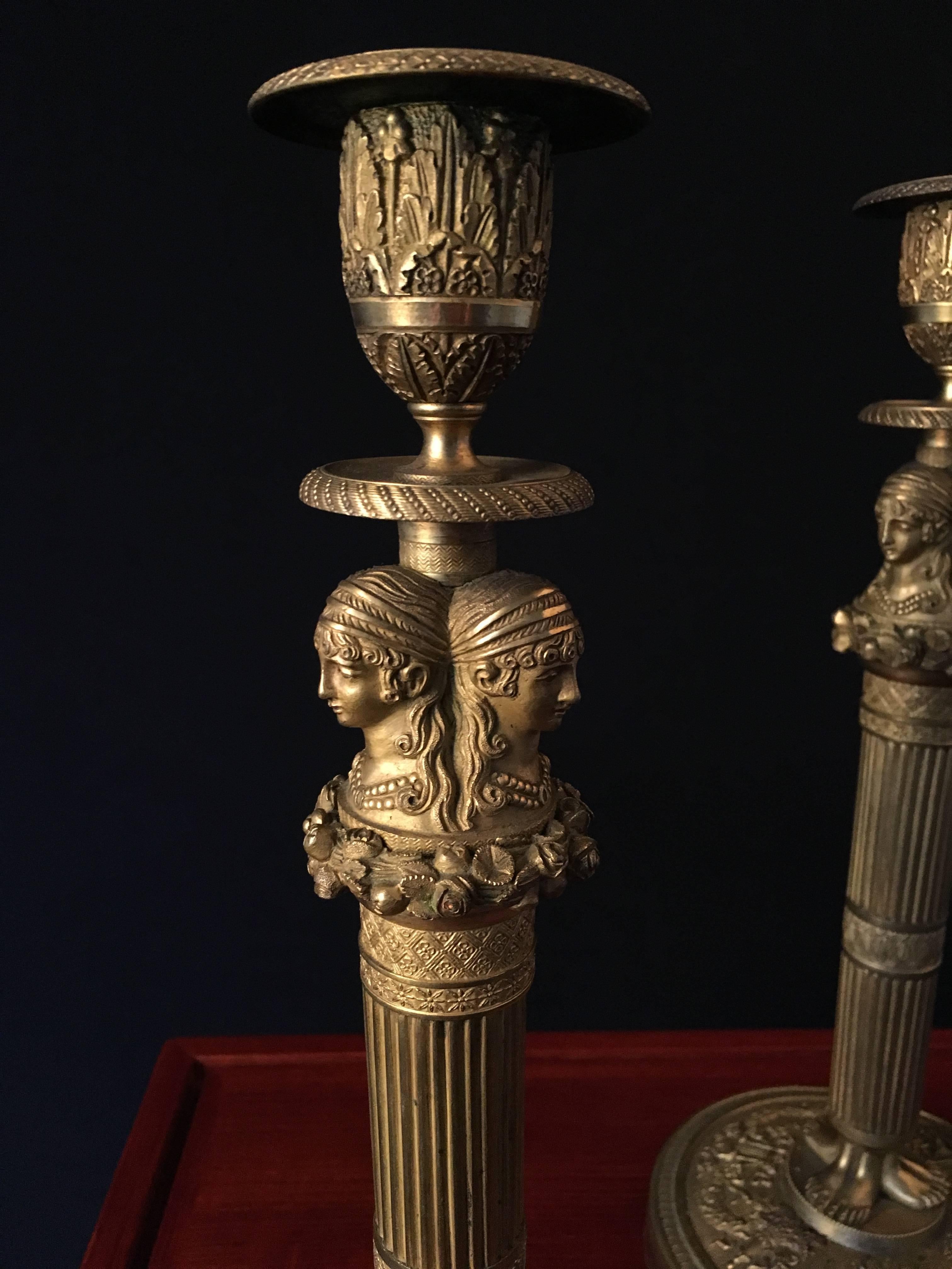 Empire Pair of Gilded and Sculpted Bronze Candlesticks For Sale