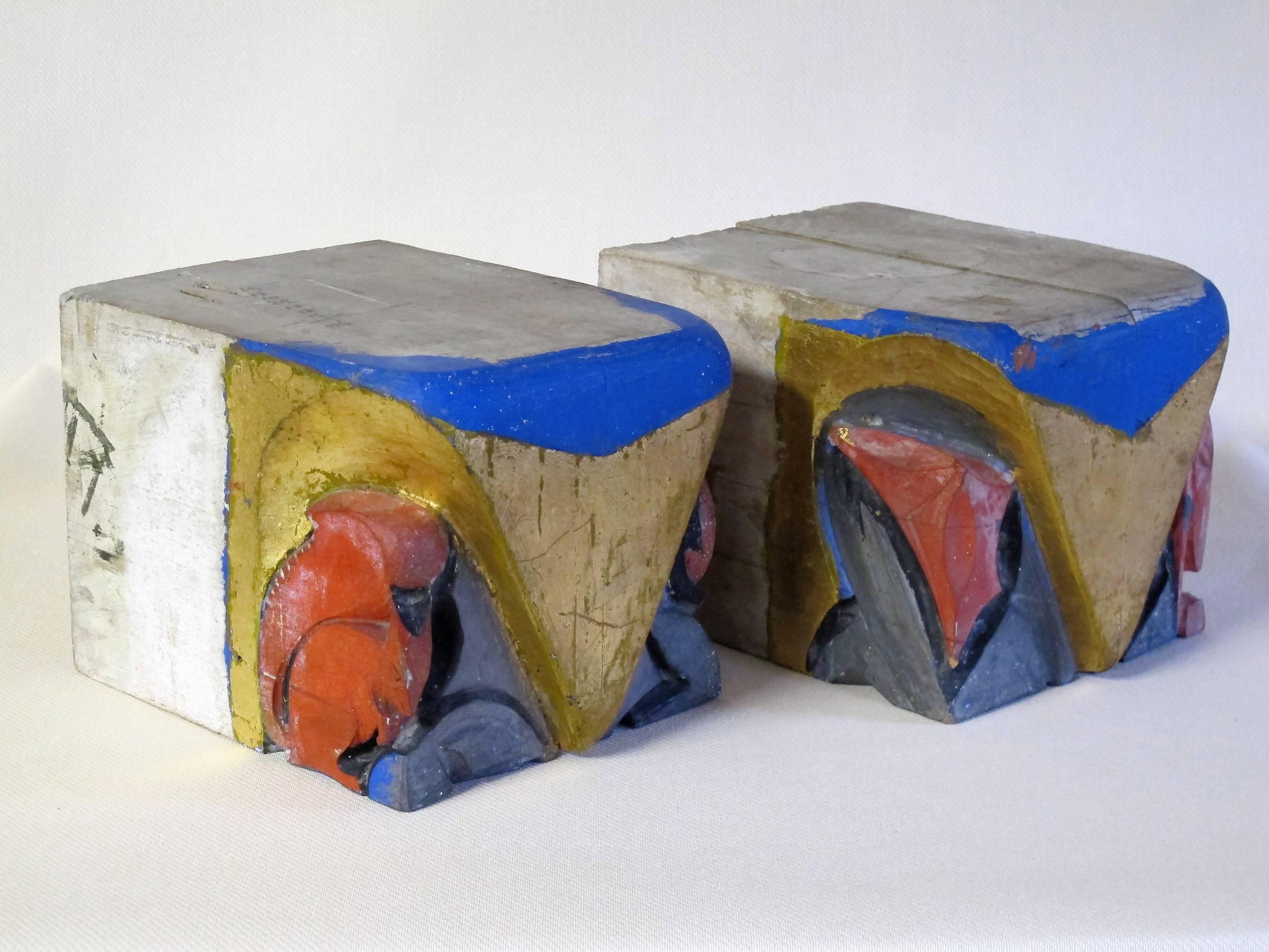 Beautiful polychromed wooden consoles by Dutch sculptor Hildo Krop (1884-1970).
The wooden consoles are carved with a squirrel and a pelican and partly painted with gold, red and blue paint.
These ornaments have similarities with the ceramics