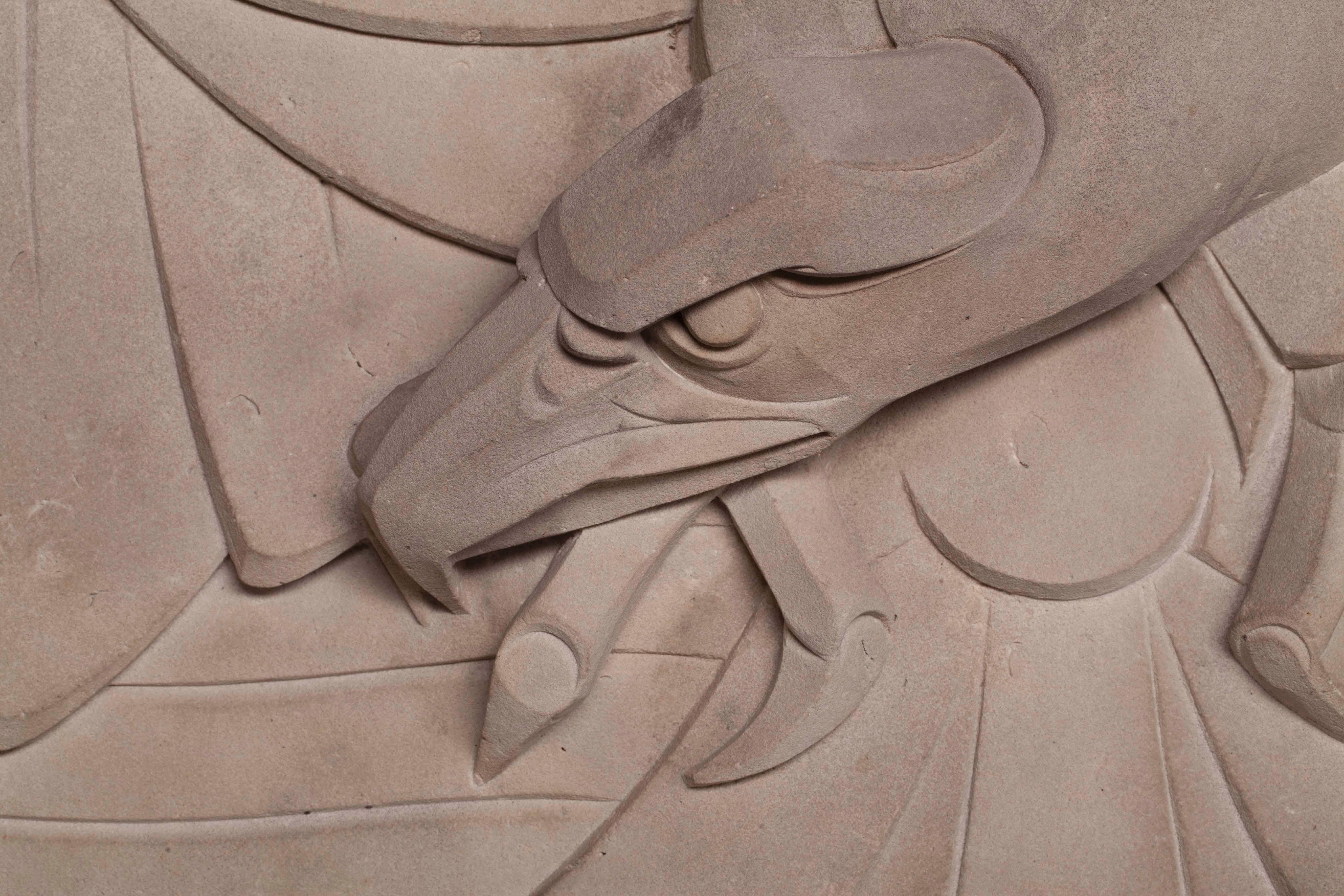 Carved gable stone of an eagle with widespread wings, designed and executed by Johan Coenraad (Jan) Altorf (1876-1955). This piece was commisioned by Cornelis Bruynzeel sr. (1875–1956), owner of the woodworking factory De Arend (The Eagle) in