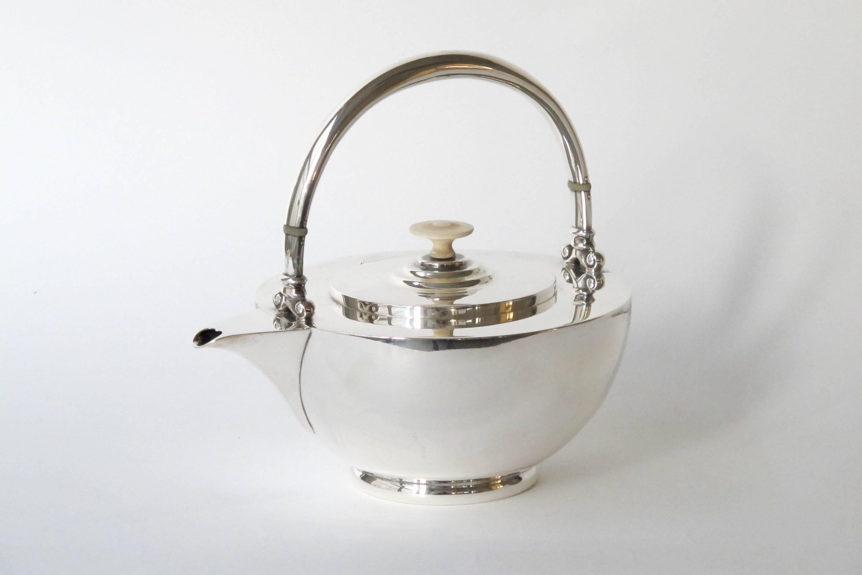 This beautiful four-piece sterling silver teaset is made by the German manufacturer Koch & Bergfeld in Bremen for Roelof Citroen, an established retailer of silverware in Amsterdam. Koch & Bergfeld is one of the world's oldest producers of