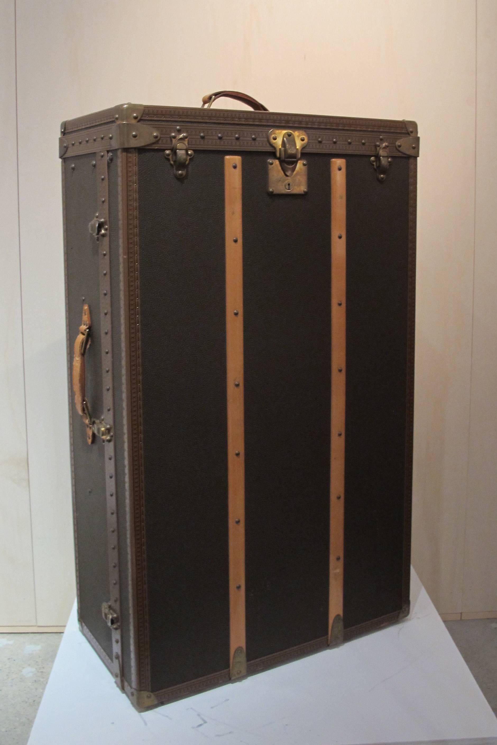 This beautiful custom-made wardrobe trunk from Louis Vuitton is designed in the 1980s. The owner did not want to expose his wealth and therefore requested that the typical and recognizable signature 'LV' would not be applied in the design too