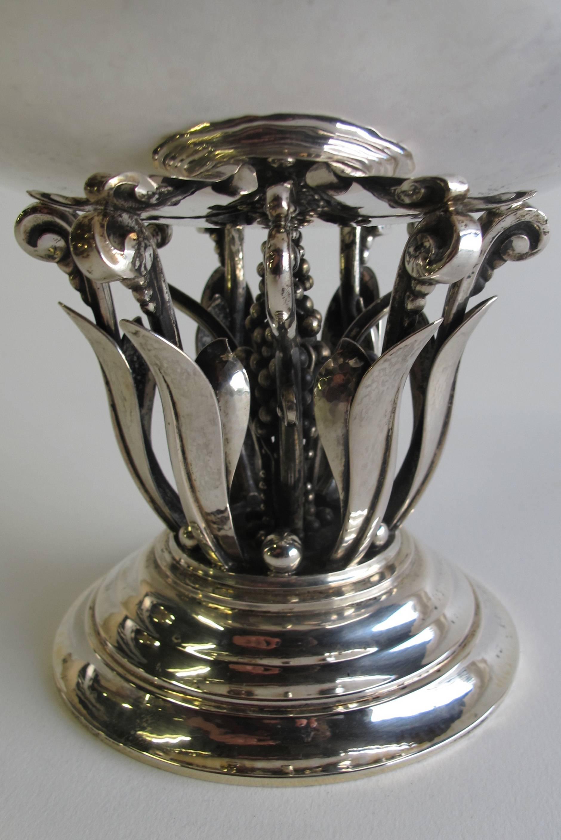 Large hammered silver centrepiece designed by Johan Rohde for Georg Jensen, circa 1916. The bowl rests on an openwork stem with leaves, clusters and beads and a circular foot. The number of this design is 196. The piece is executed between