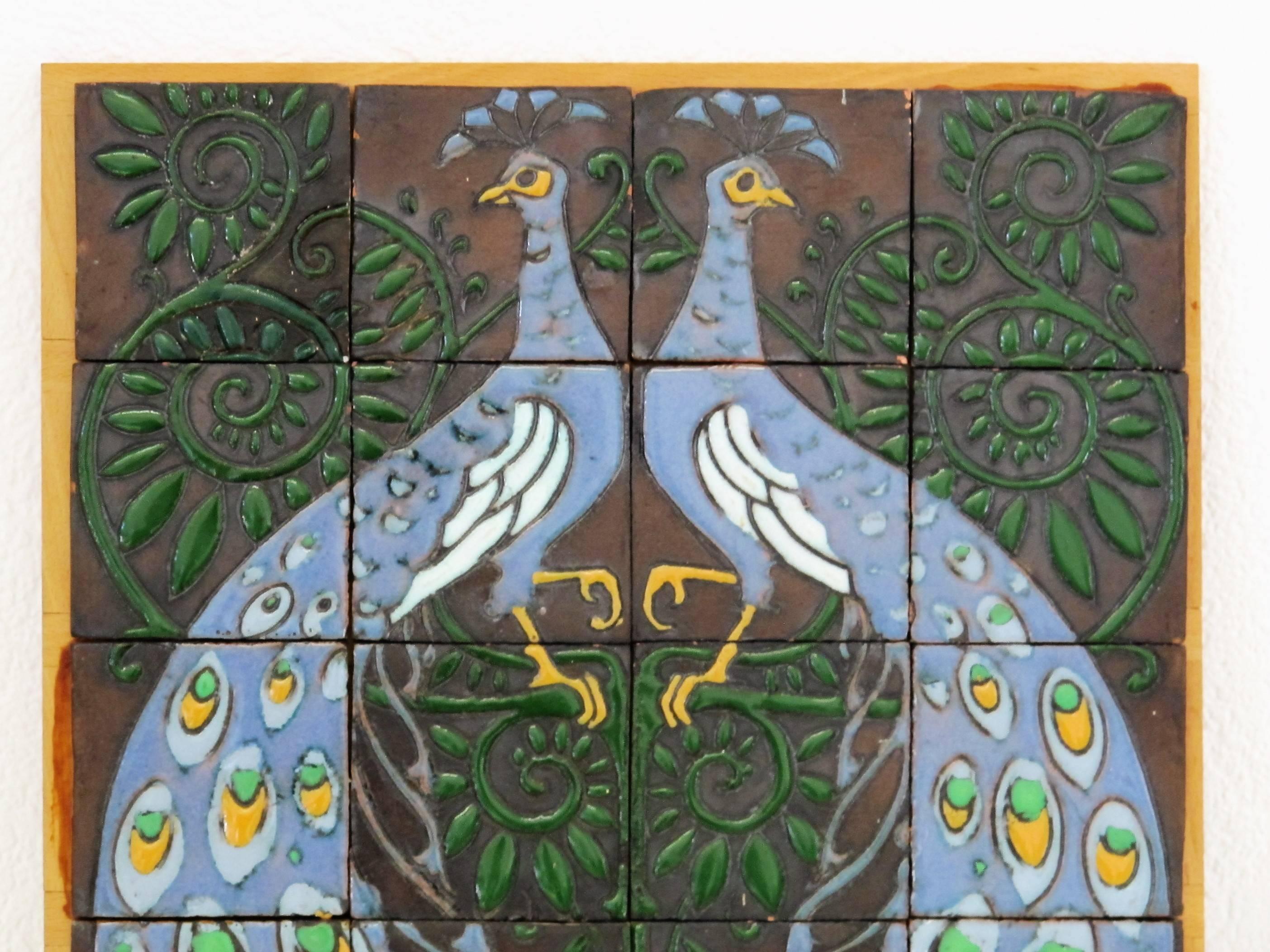 Beautiful Art Nouveau tile tableau with peacocks, in the style of Willem van Norden (1883-1978), executed by Dutch pottery De Distel, Amsterdam.

Executed in the typical Distel carduus technique. The mark on the back of the tile is also very