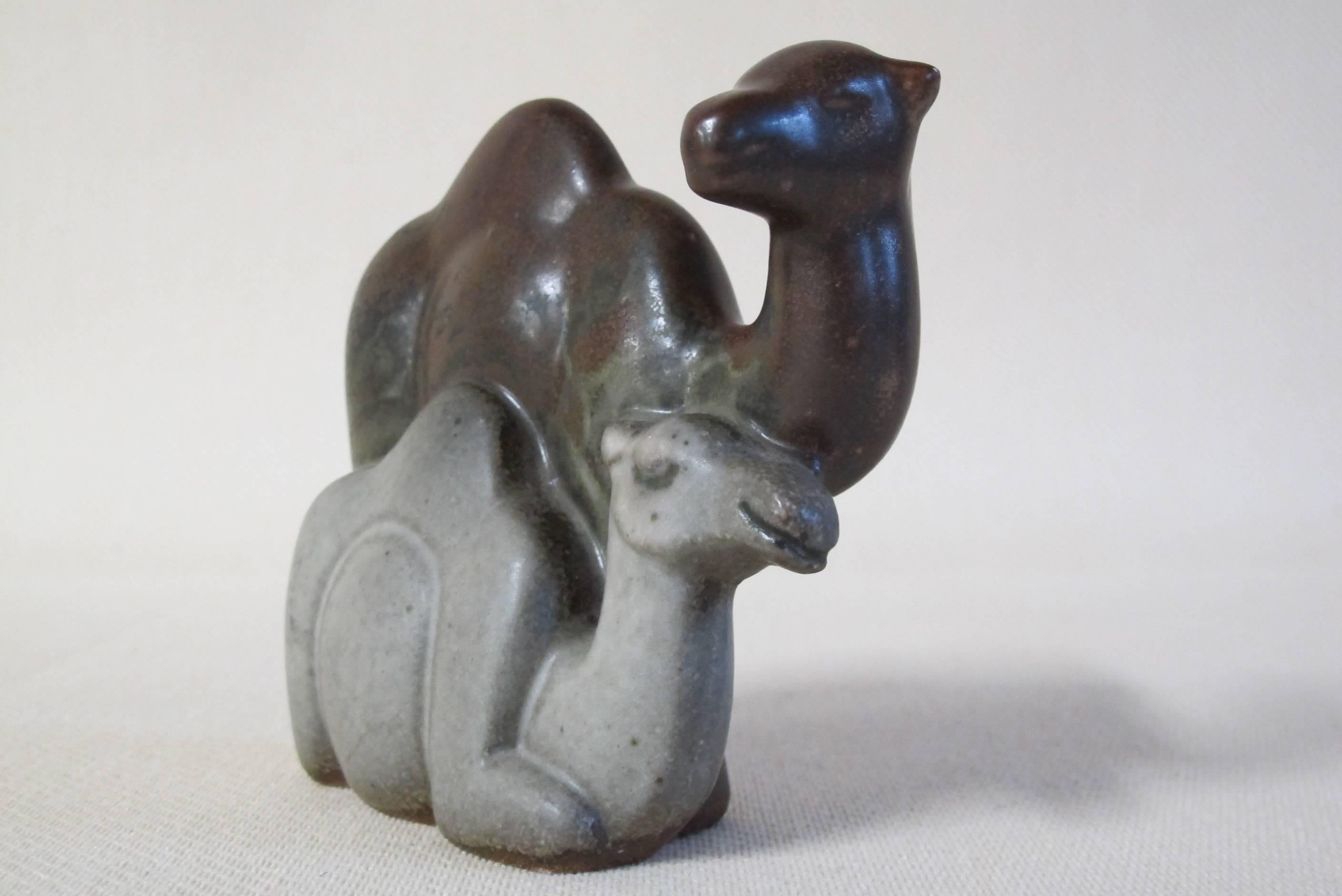 Very decorative Mid-Century animal sculpture with beautiful brown and grey glazes by well known German sculptor Emy Roeder.

Emilie Julie (Emy) Roeder (Würzburg, 30 January 1890 – Mainz February 7, 1971) was a German sculptor and draughtsman. She