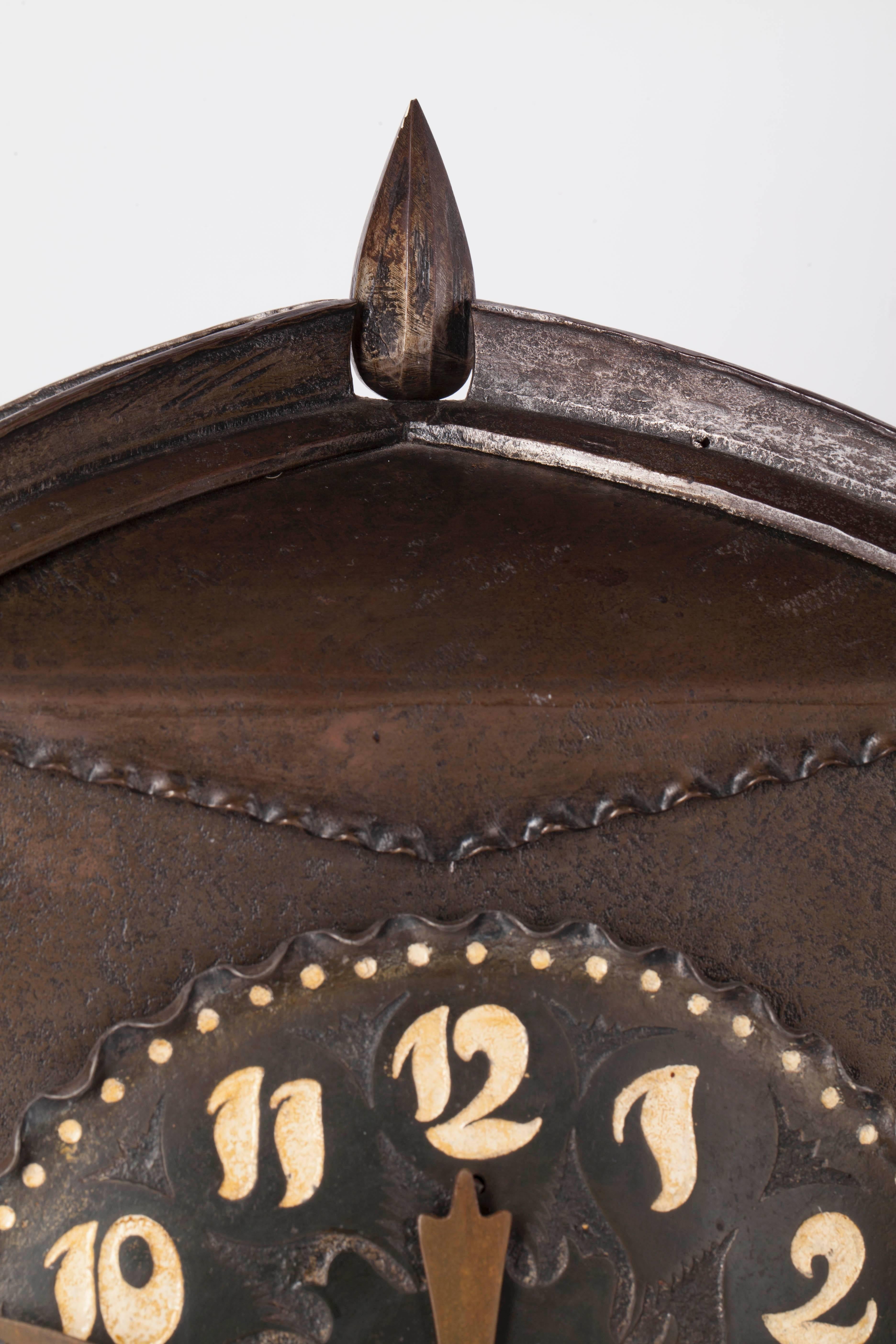 A beautiful wrought iron three-part clock set from the period of the Amsterdam School, circa 1920. The timepiece is running and checked, the hands are original from the Amsterdam school period, but not original to this clock. The electrical