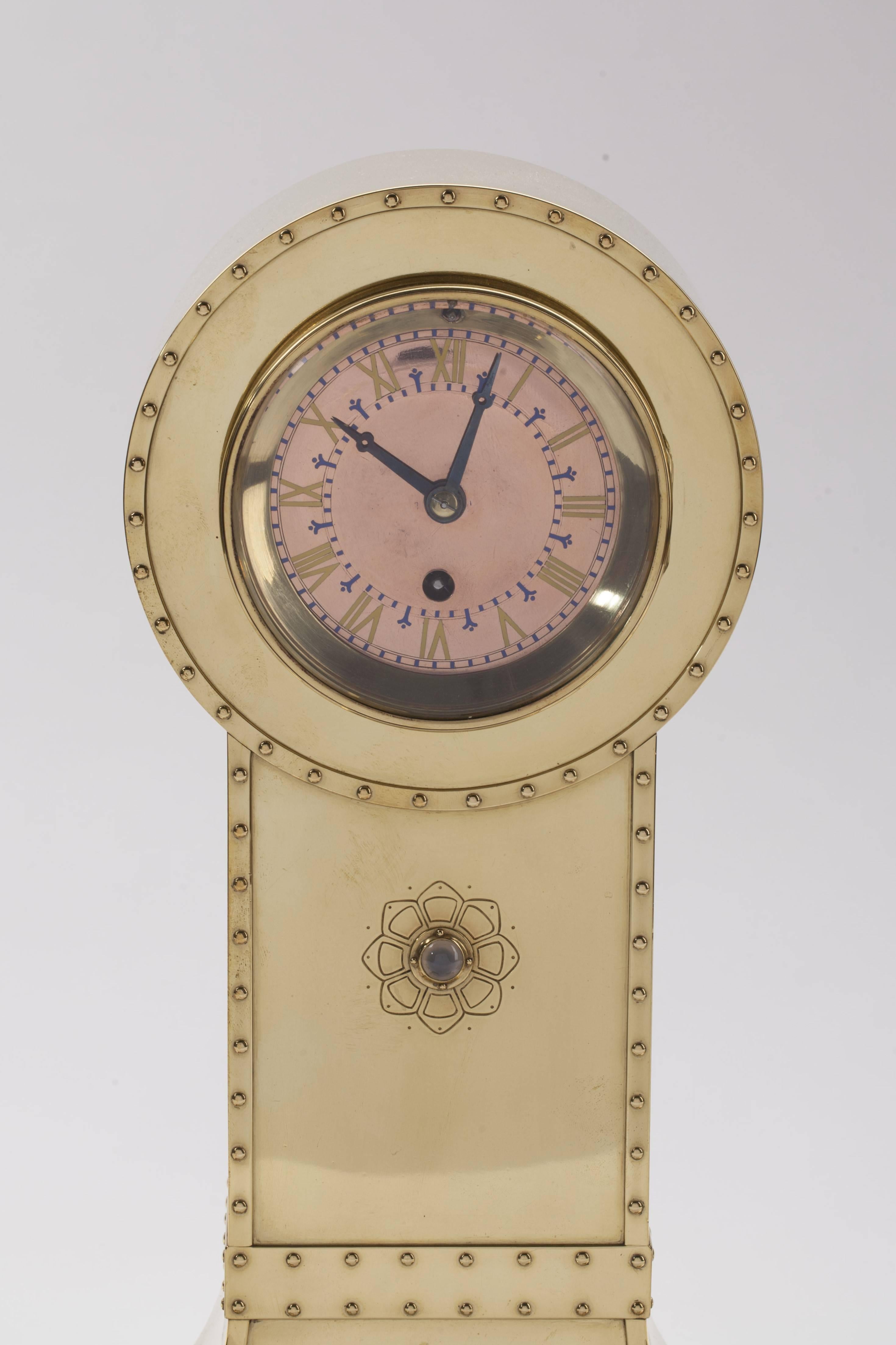 This three-parted clock set designed in the constructivist style, consists of a clock and two candelabra, each with three candlestick holders. On the back of the clock is the brand of Amstelhoek (a circle containing an A, a H and a small o).
The