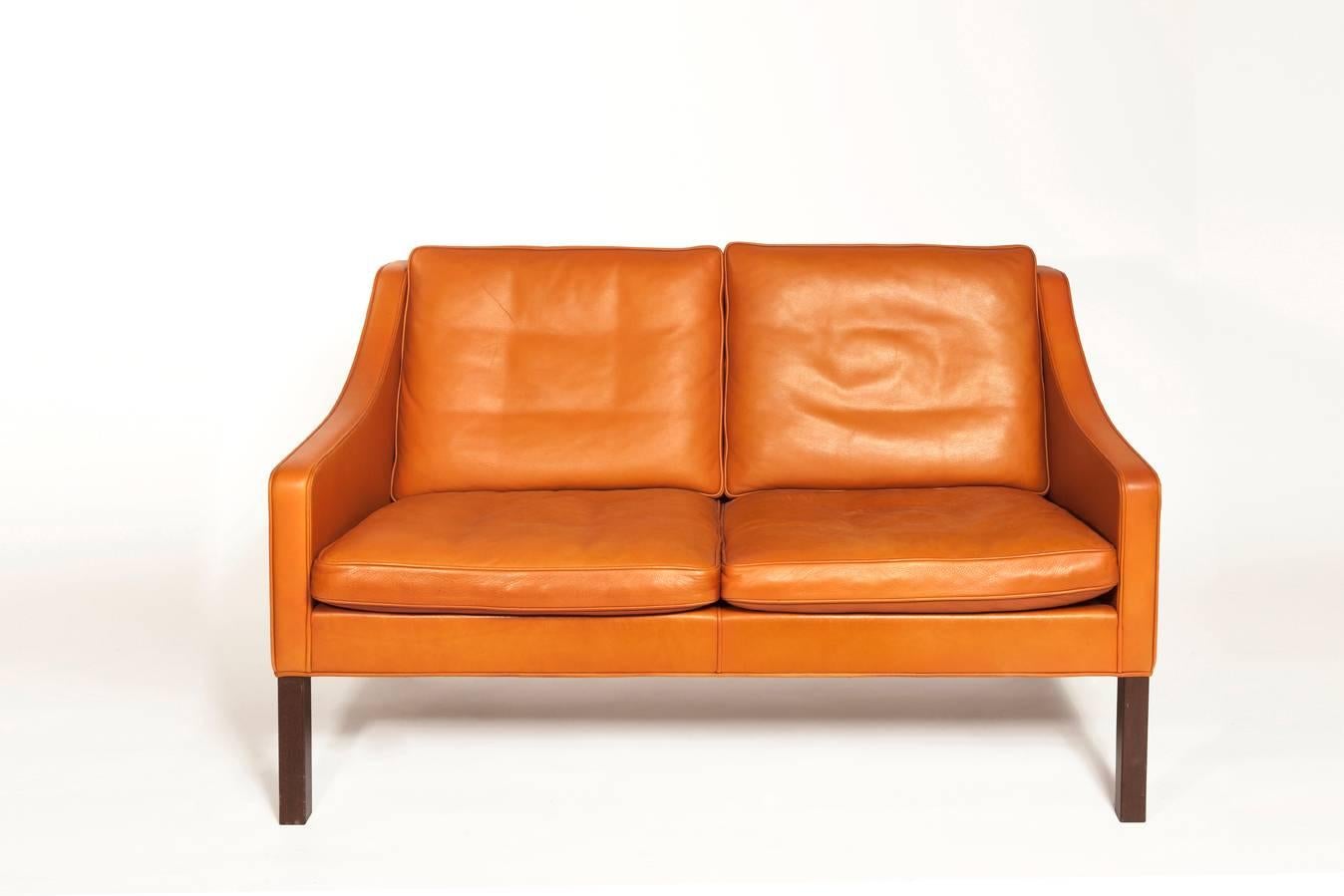 This beautiful orange leather sofa has an elegant simplicity to it. The high quality leather makes the sofa both comfortable and durable. A timeless piece of design and a great addition to the modern home.

Børge Mogensen (Aalborg, 13 April 1914–5