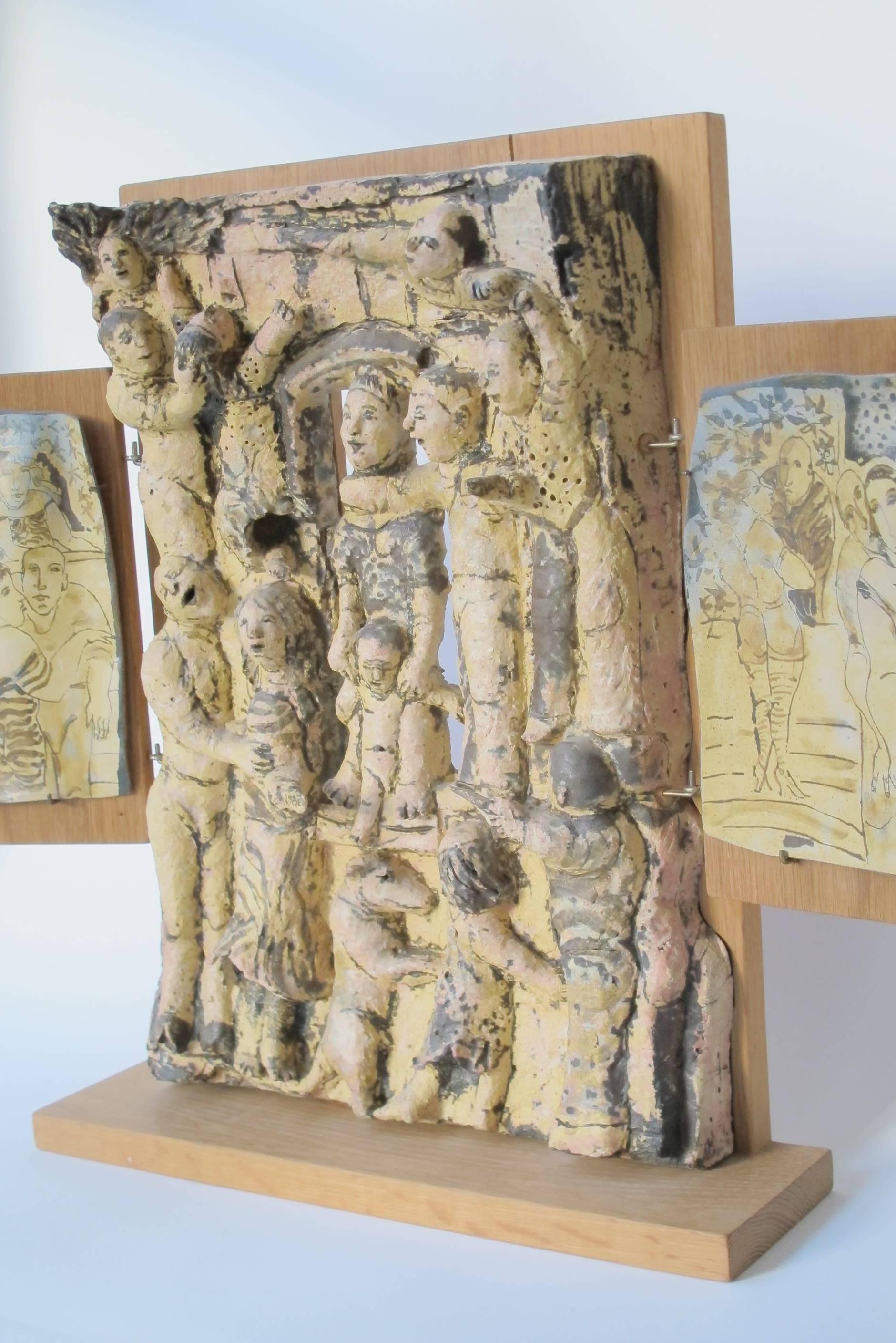 This unique stoneware triptych sculpture was made by Dutch ceramist Lies Cosijn in 1997. The triptych is hand-painted and shows us three different scenes. The largest part in the middle, displays a number of figures surrounding a mother figure with