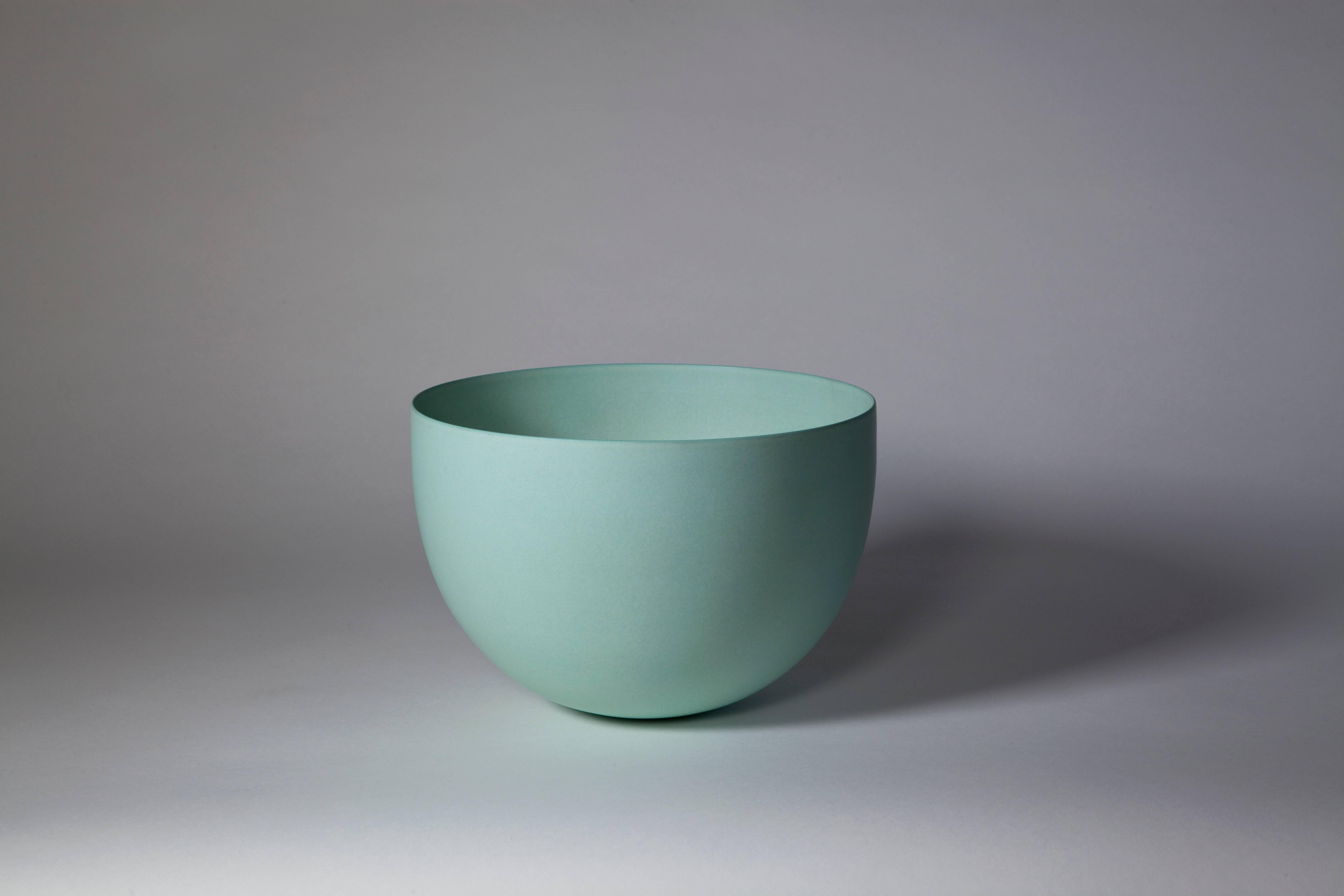 Unique bowl created by Geert Lap. Based on the shape and color, this bowl can be dated circa 1988. In 1987, Lap began using a terra sigilata glaze on his stoneware. This terra sigilata glaze gives a beautiful semi-matte satiny sheen and also