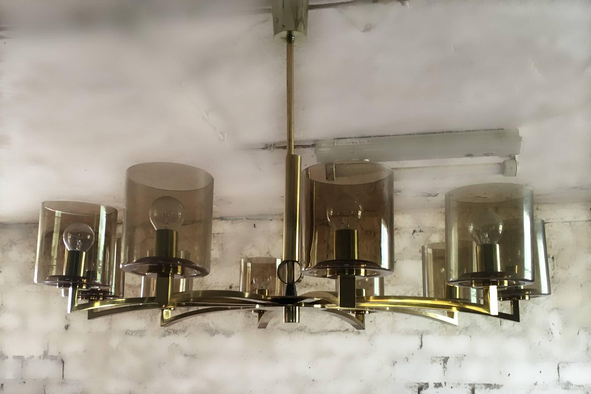 A Ten-Light Mid-Century design brass and smoked glass chandelier.
