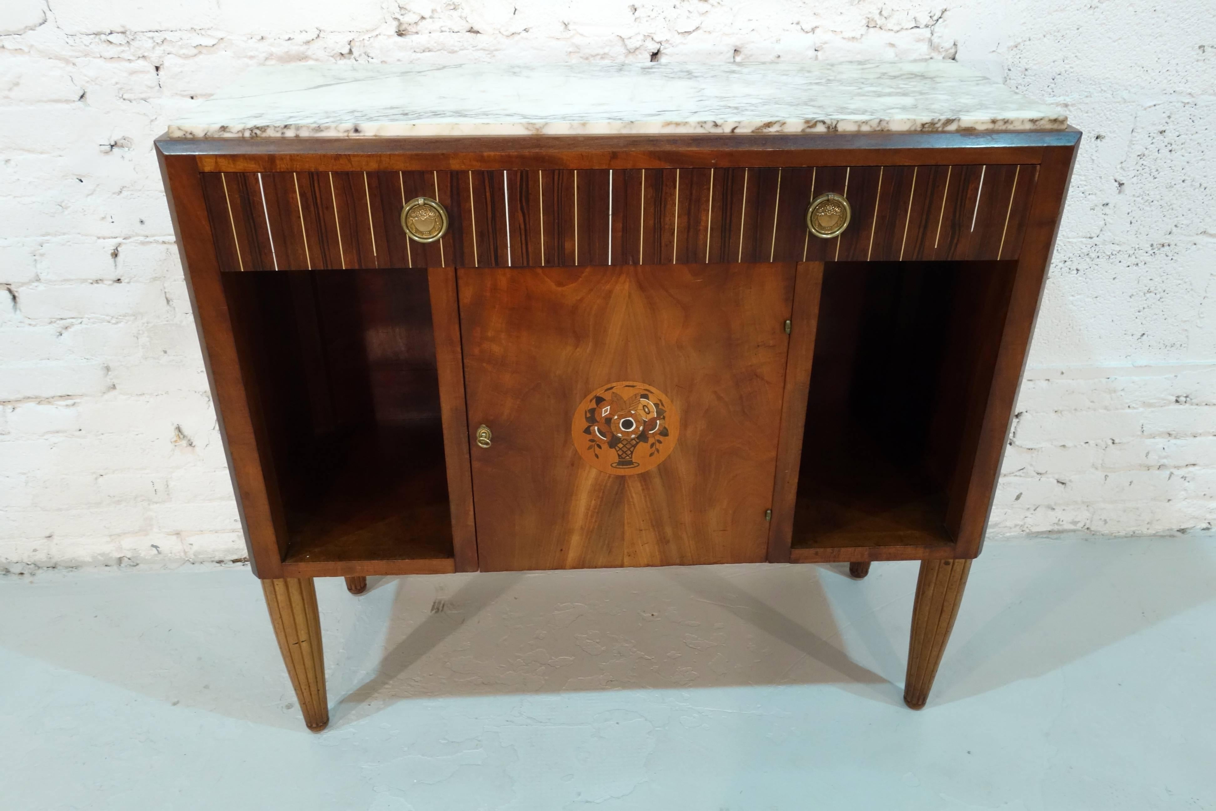 Signed French Art Deco dresser by Roche with one-door and two drawers.

  